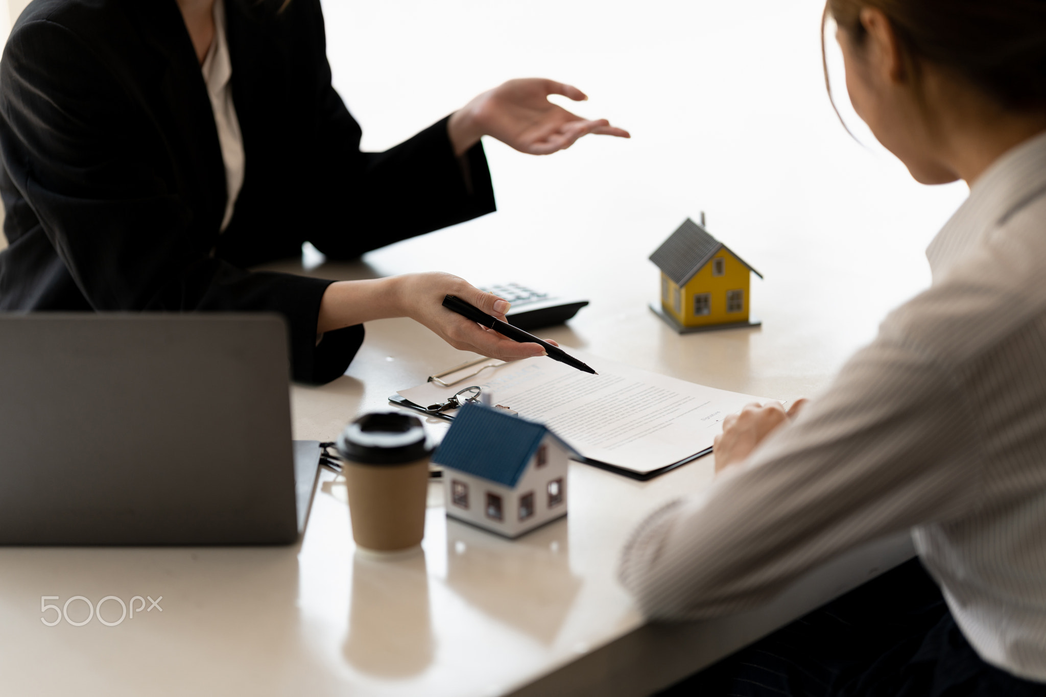 Real estate agents agree to buy a home and give keys to clients at