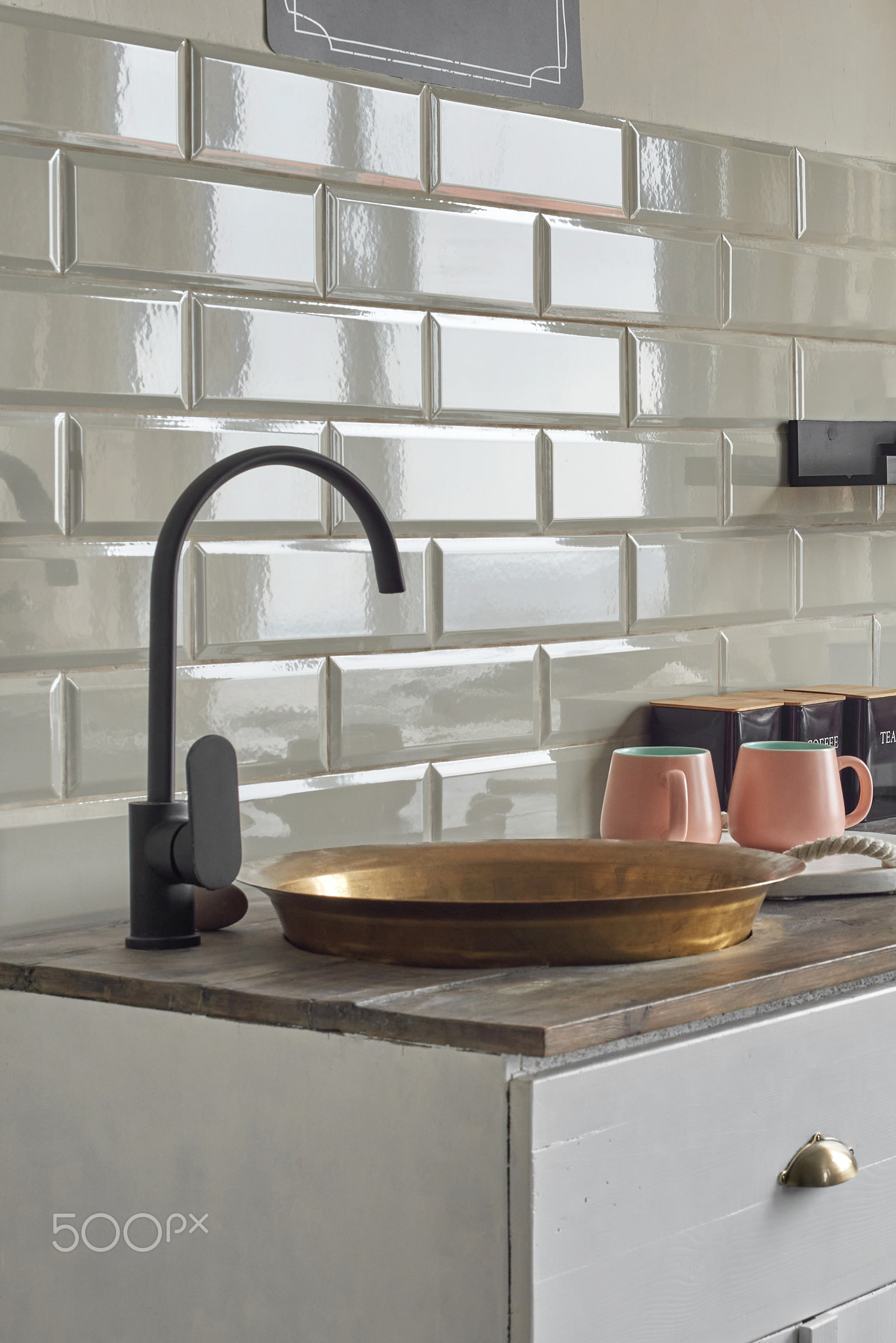 Copper sink on elegant kitchen counter at country house.