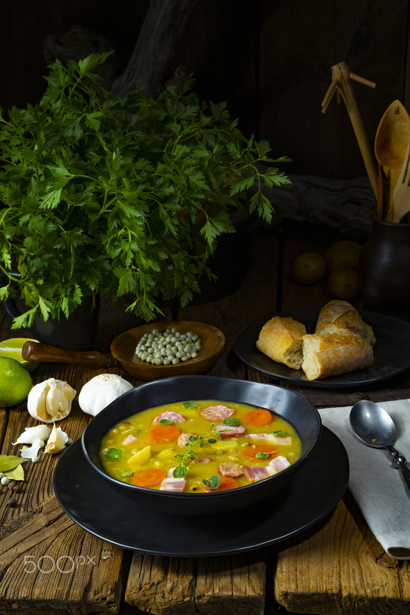 Hearty rustic pea soup with bacon and sausage
