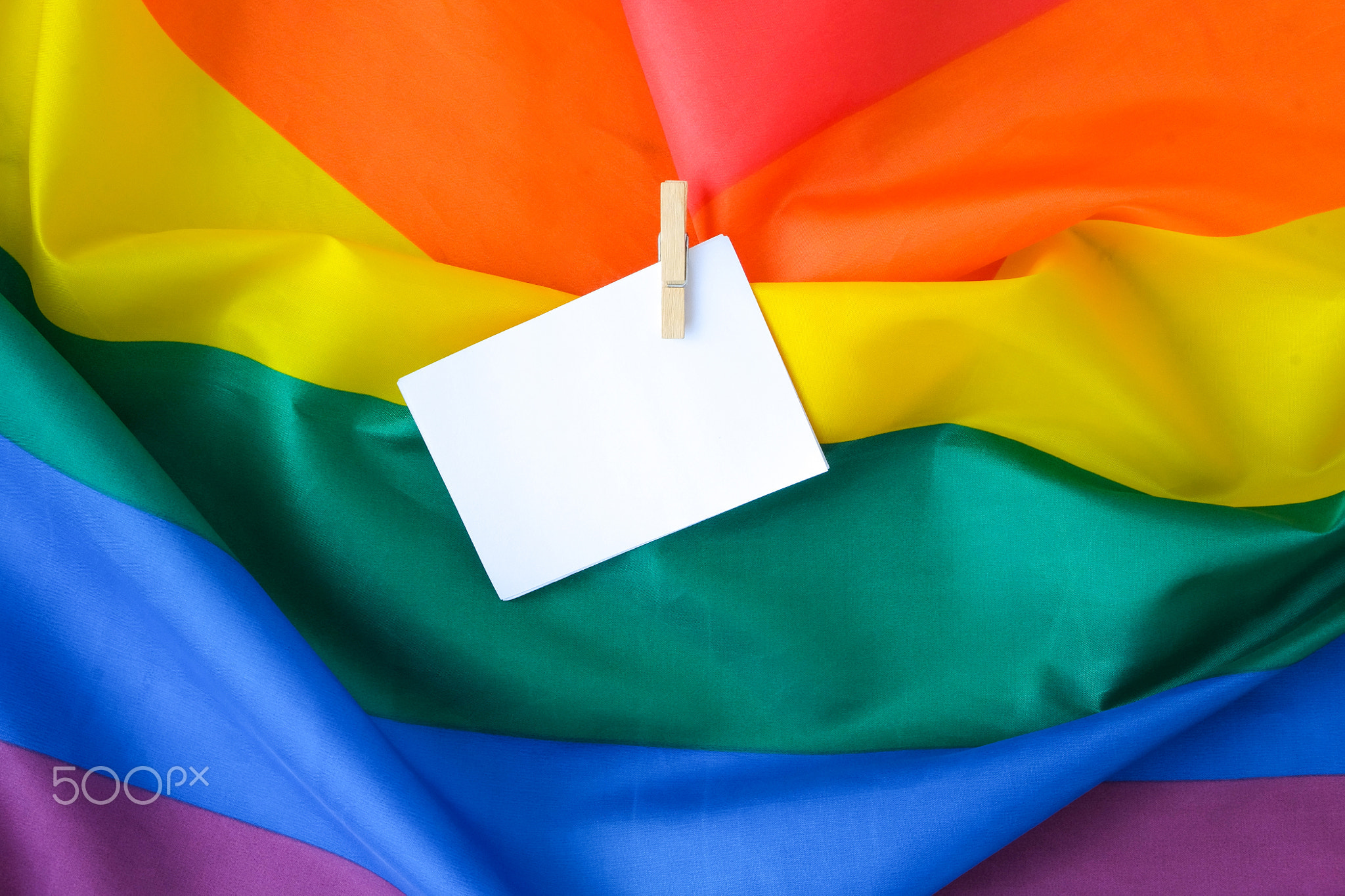 Rainbow flag with empty paper note copy space. Rainbow lgbtq flag made