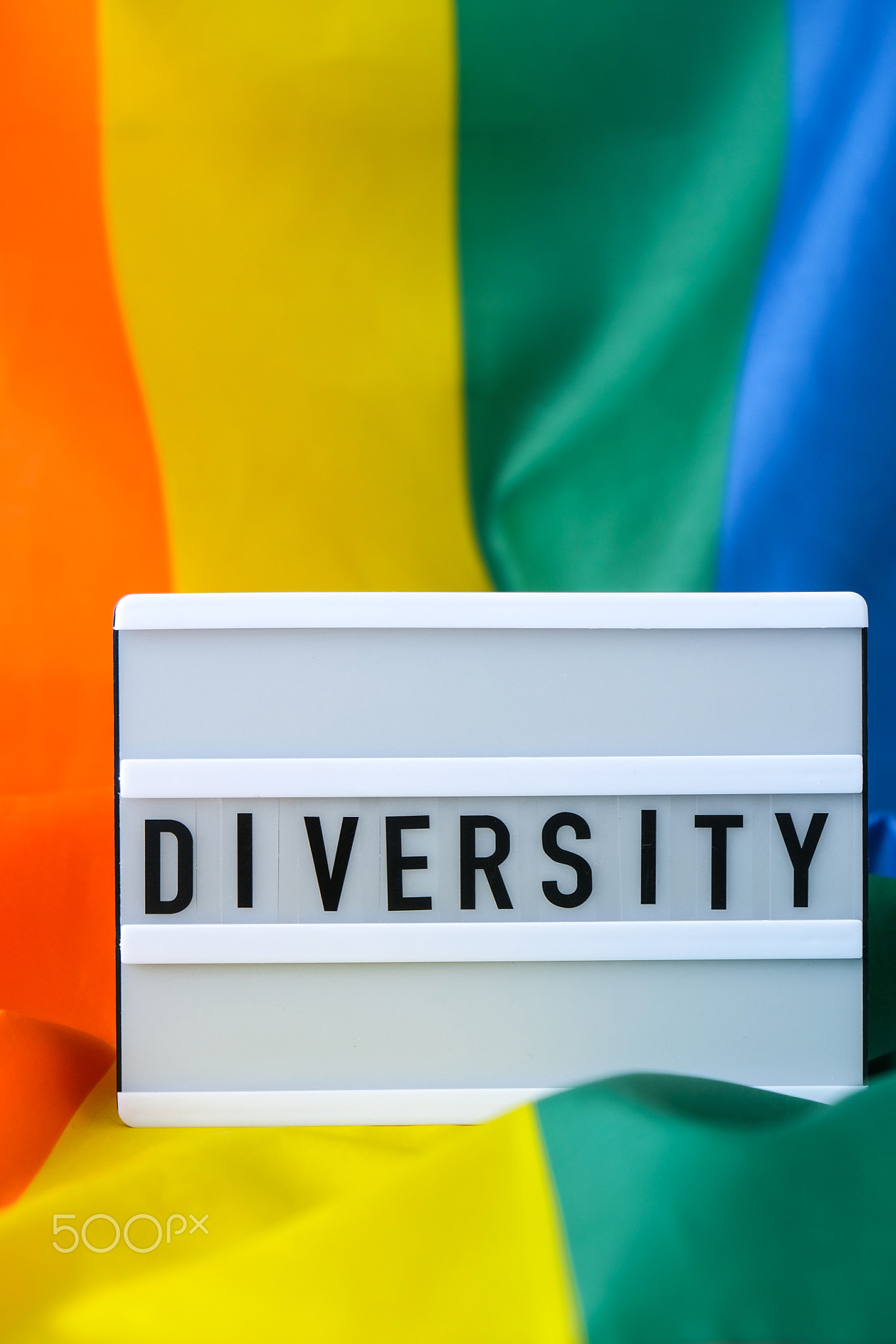 Rainbow flag with lightbox and text DIVERSITY. Rainbow lgbtq flag made