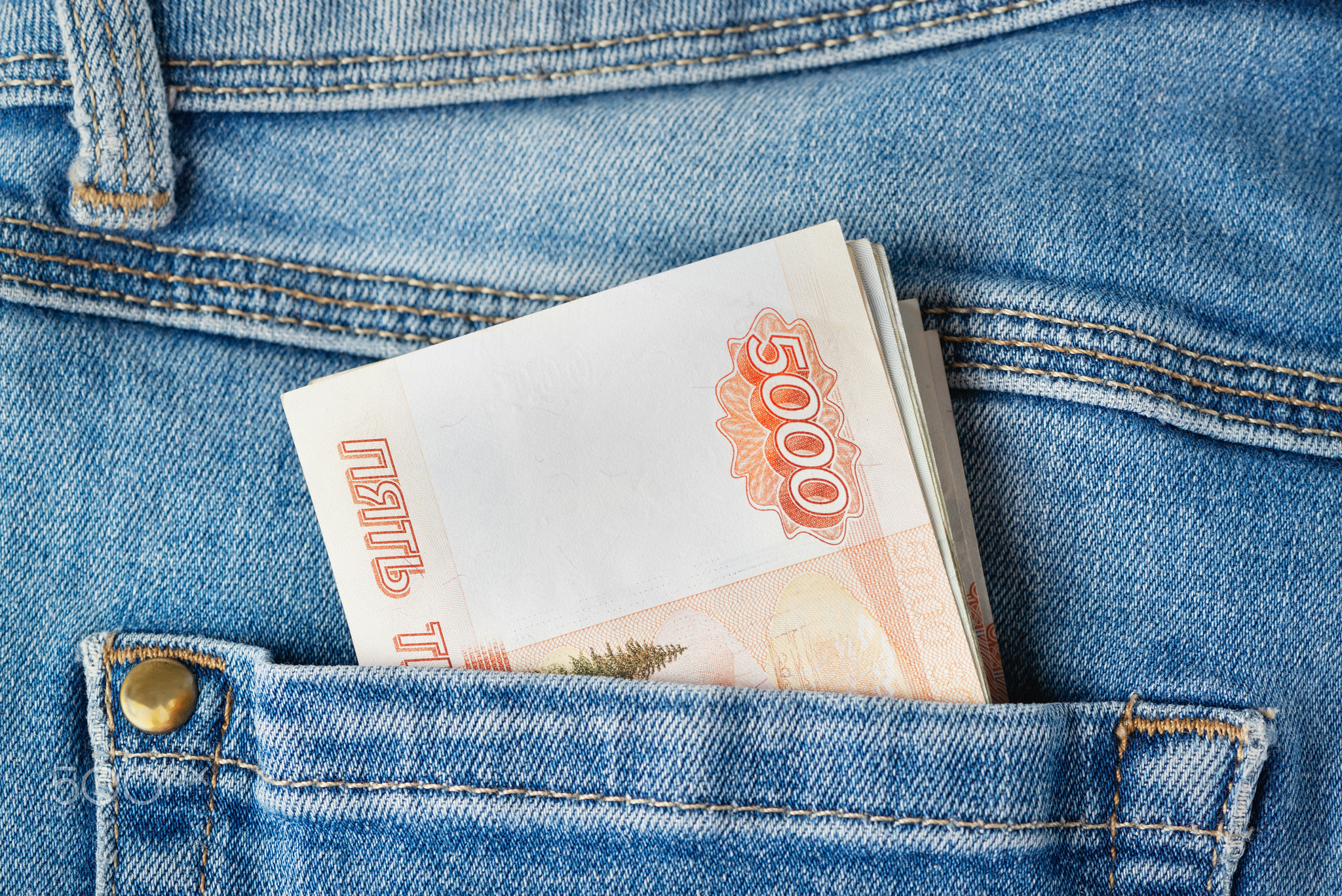 Russian rubles in the pocket of jeans