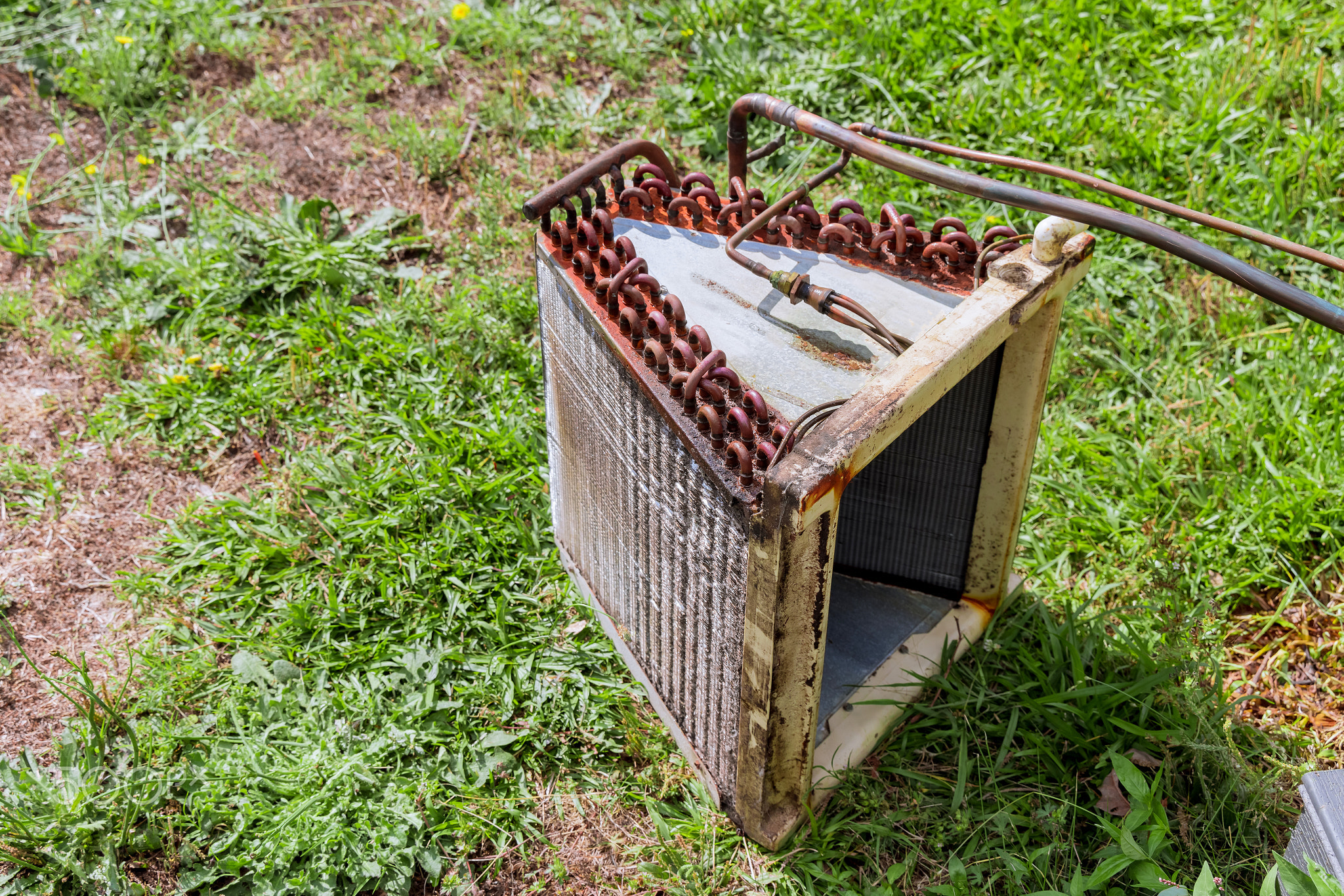 Old rusty air conditioner outdoor unit ready for replacement