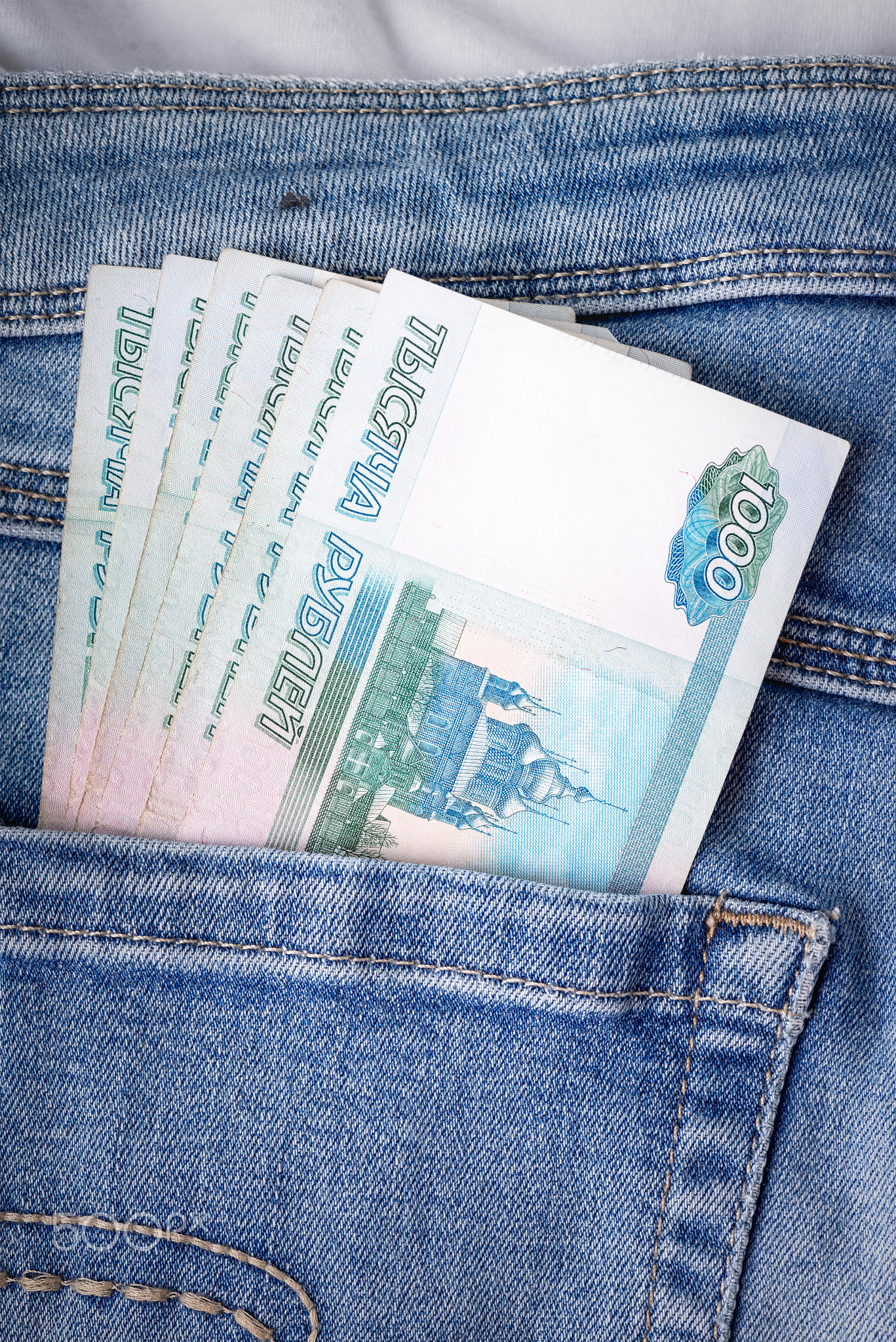 Russian rubles in the pocket of jeans