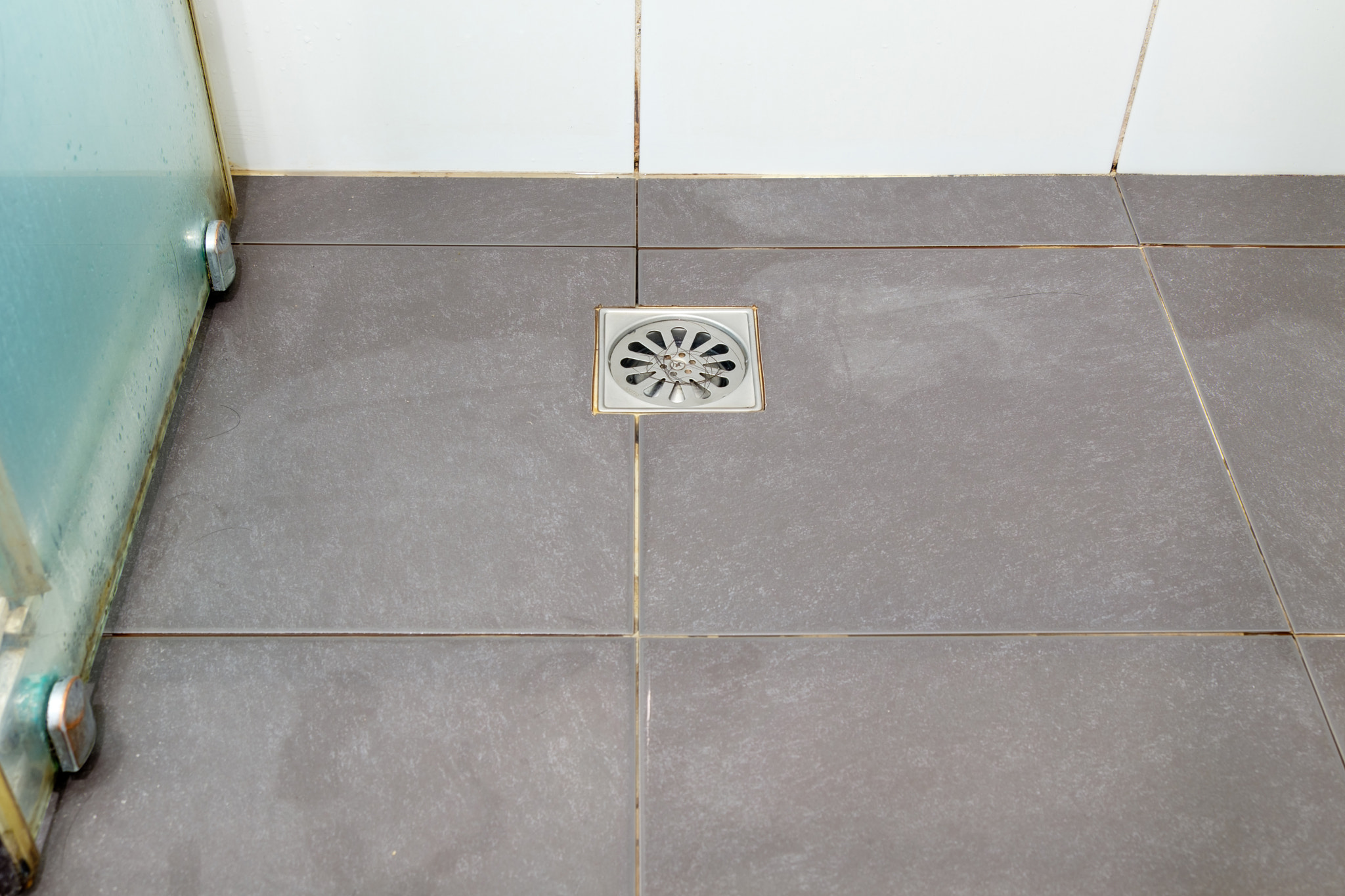 The hair loss clogs the metal drain cover.