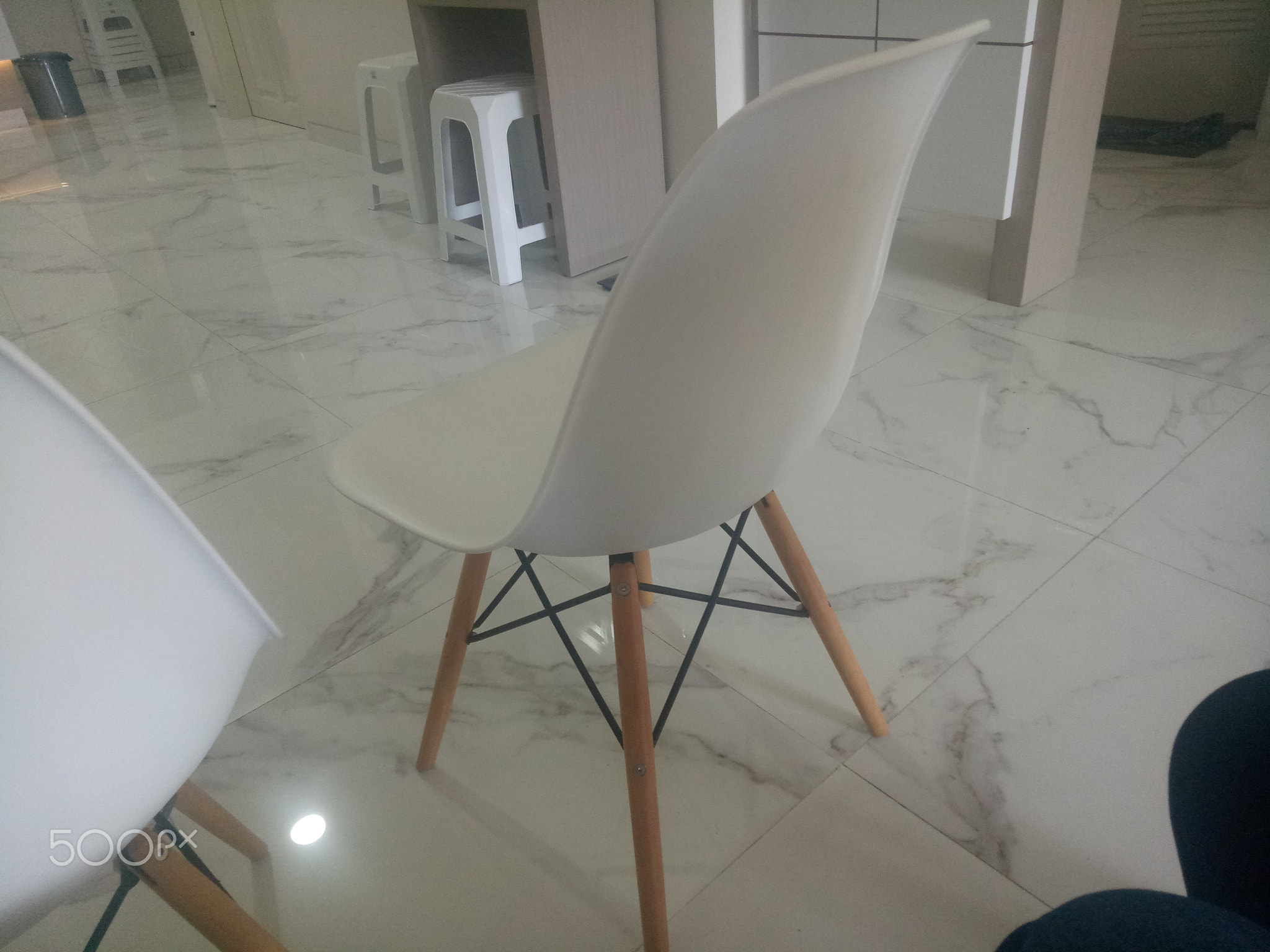 modern white chair on marble floor