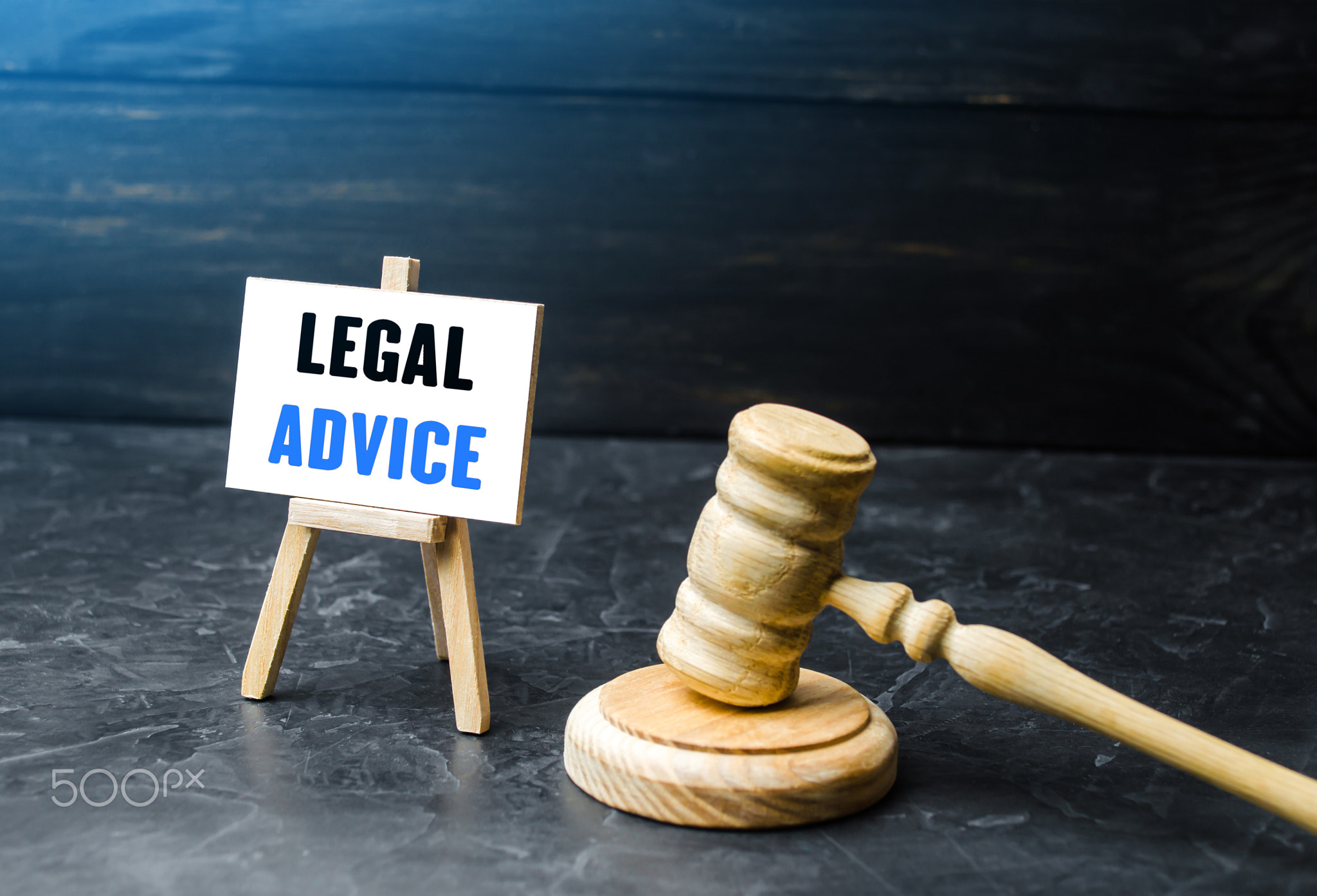 Judge's gavel and easel with legal advice.