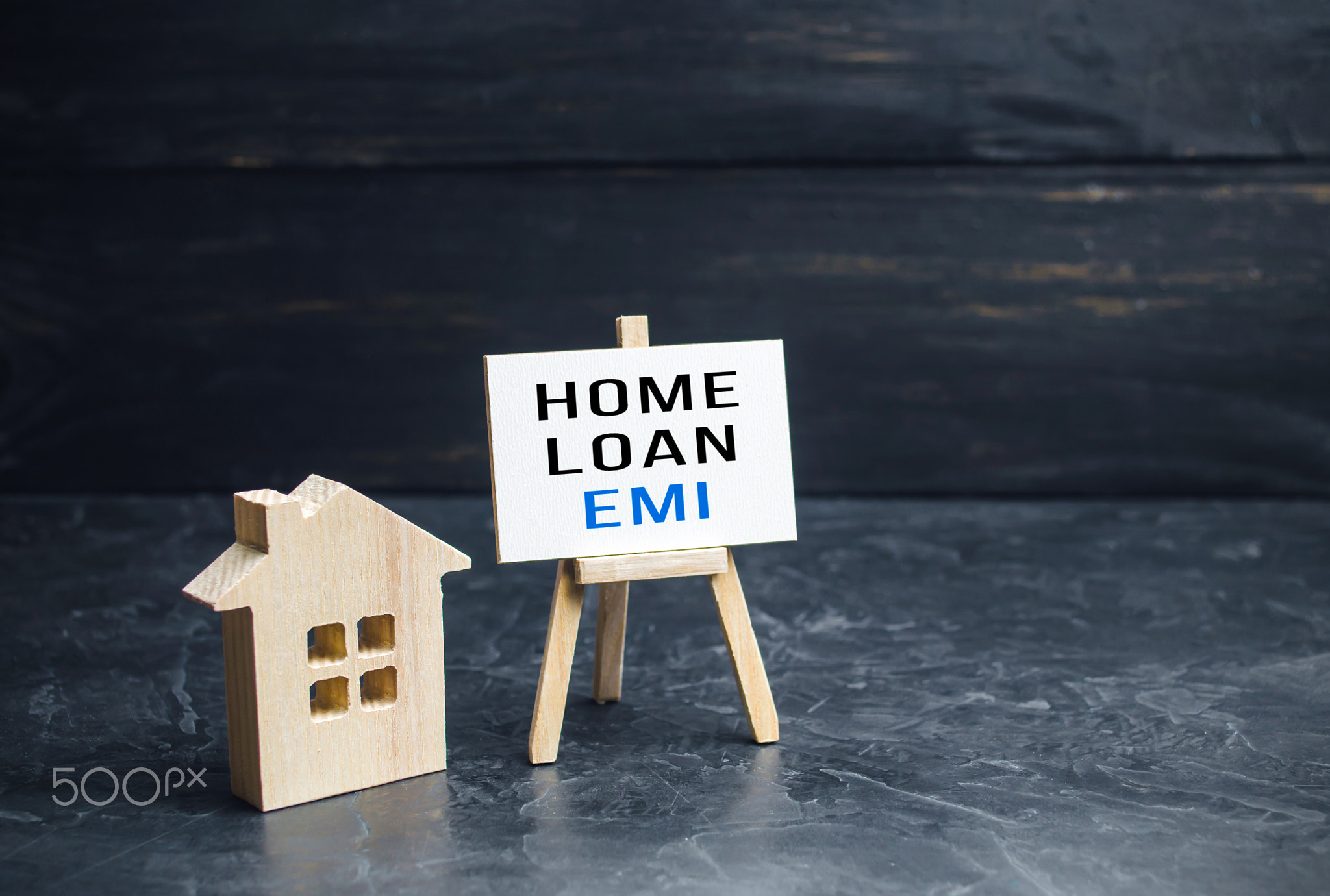 House with home loan EMI easel.