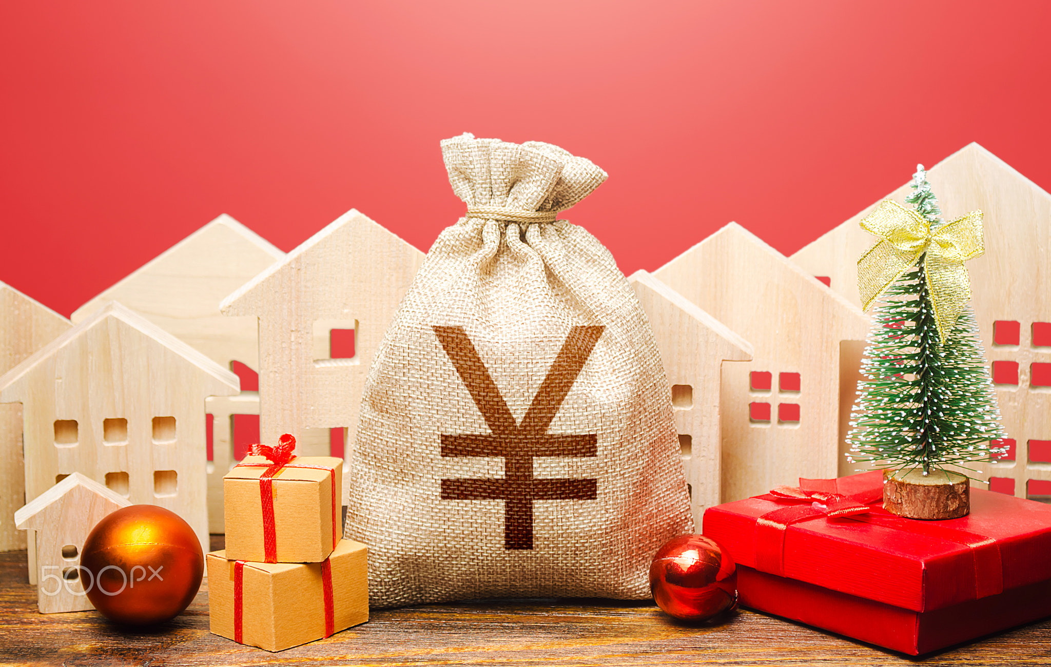 Yuan Yen money bag and houses in a New Year's setting.