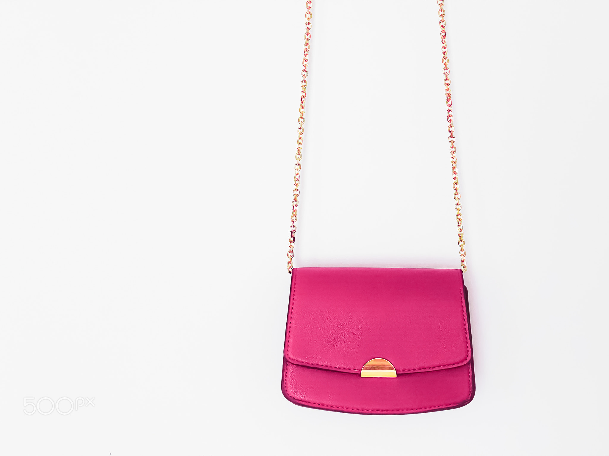 Pink fashionable leather purse with gold details as designer bag and