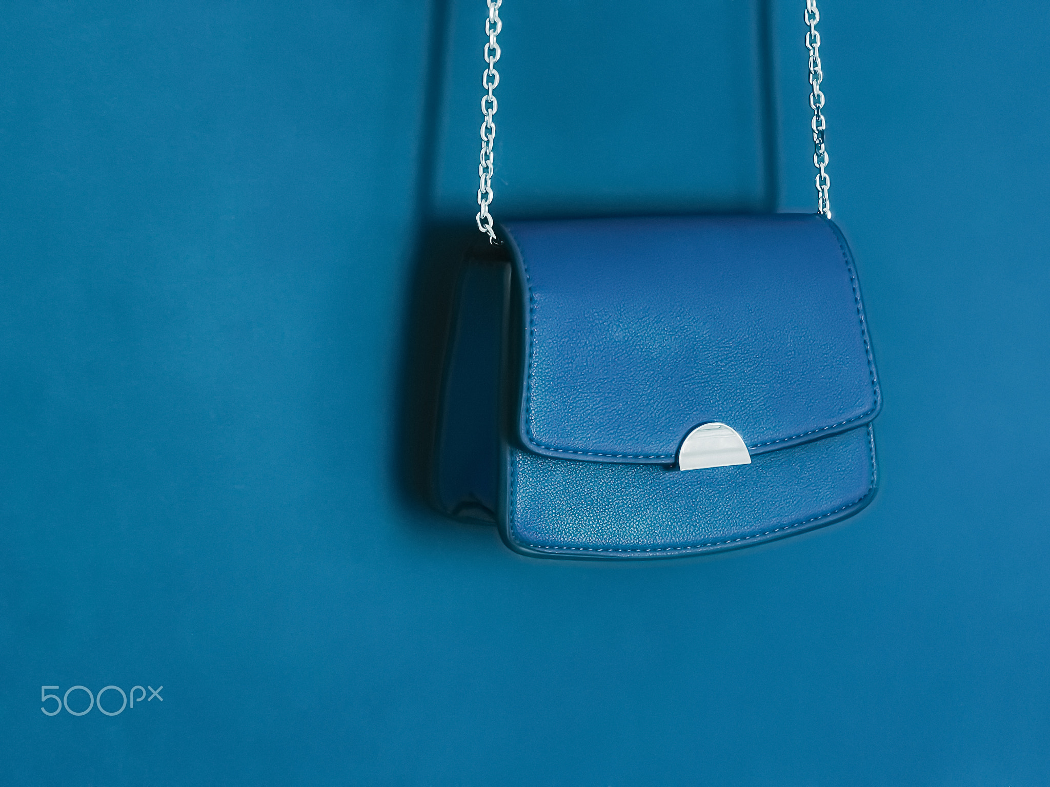 Blue fashionable leather purse with silver details as designer bag and