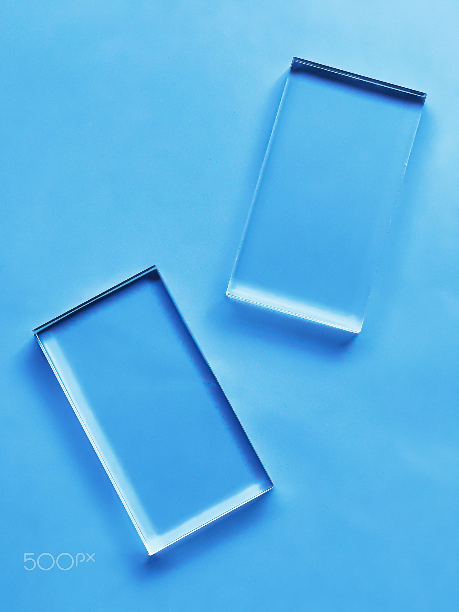 Glass device on blue background, future technology and abstract screen