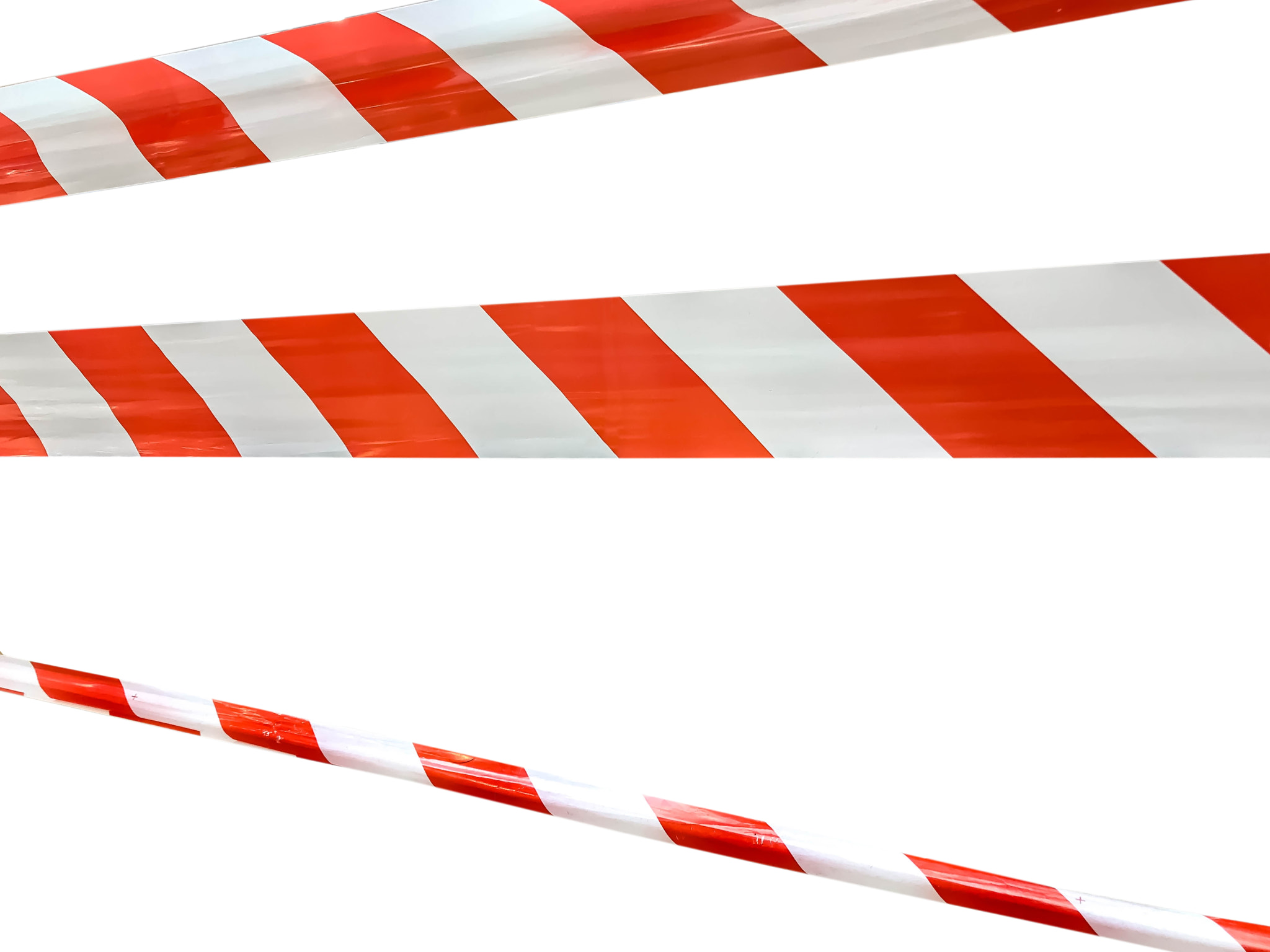 Red and white lines of barrier tape prohibit passage