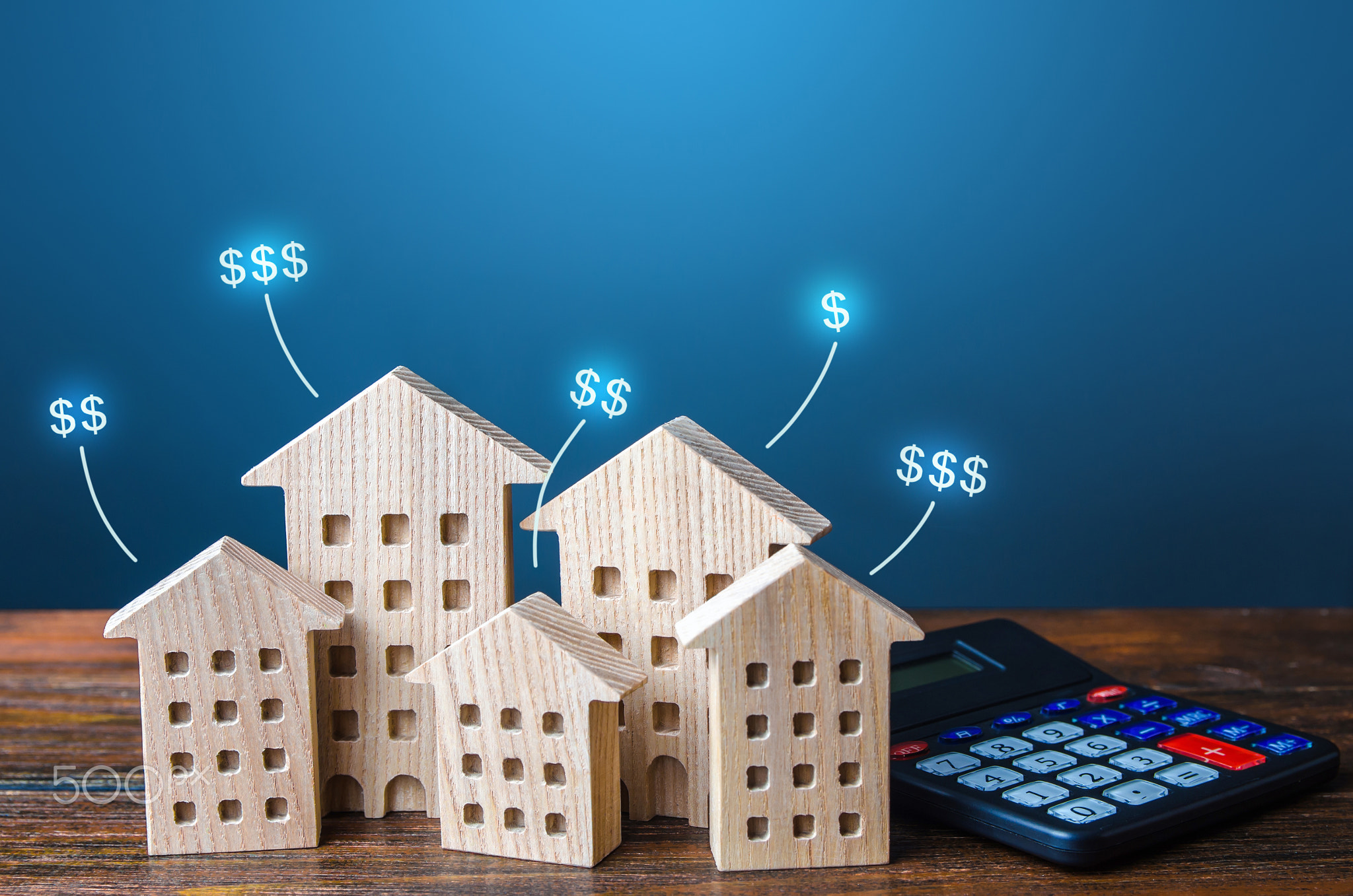 Residential buildings with dollar prices and calculator.