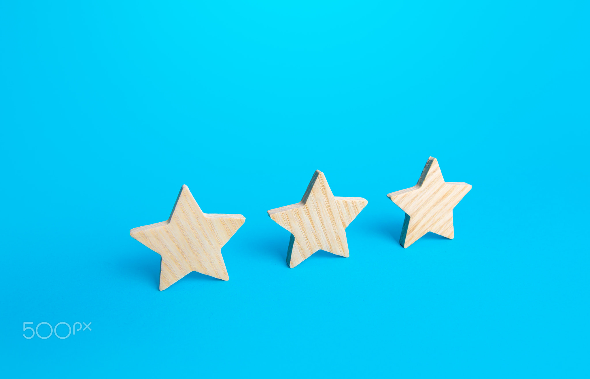 Three stars on a blue background.