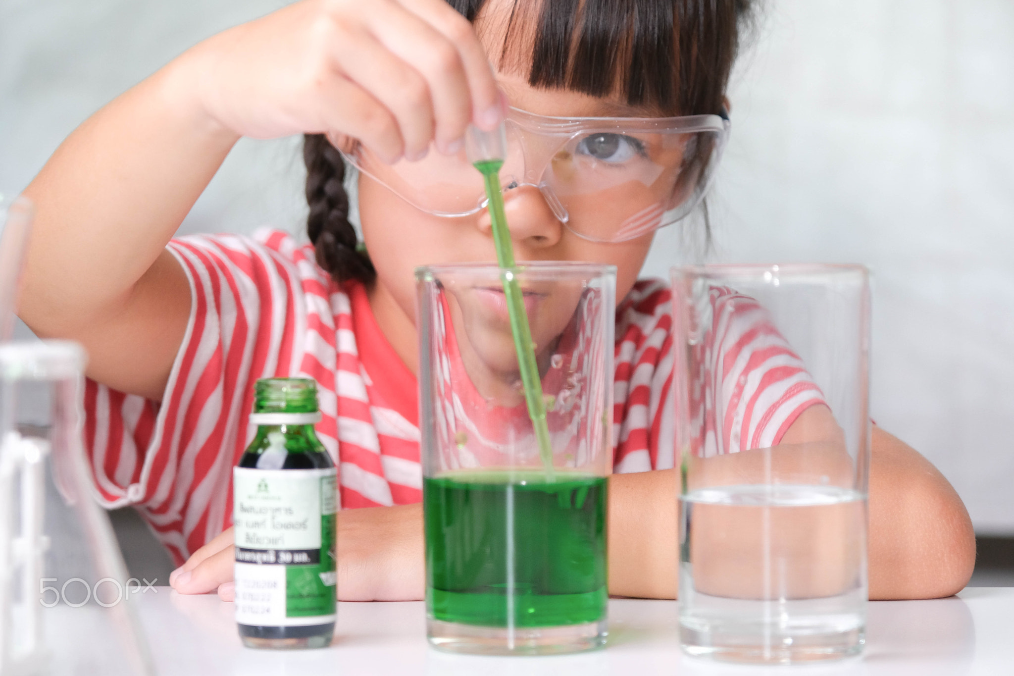 Children are learning and doing science experiments in the classroom.