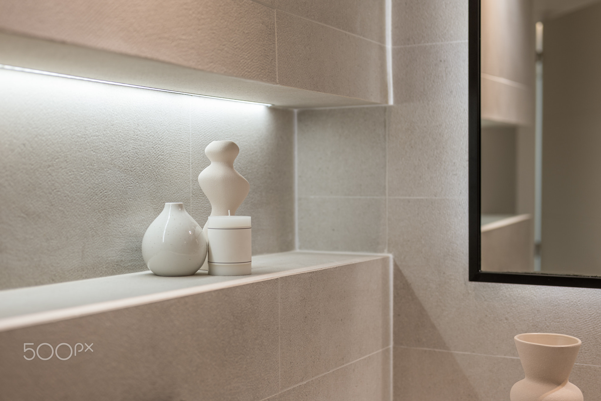 A corner of stylish bathroom with accessories. Detail shot of a shelf