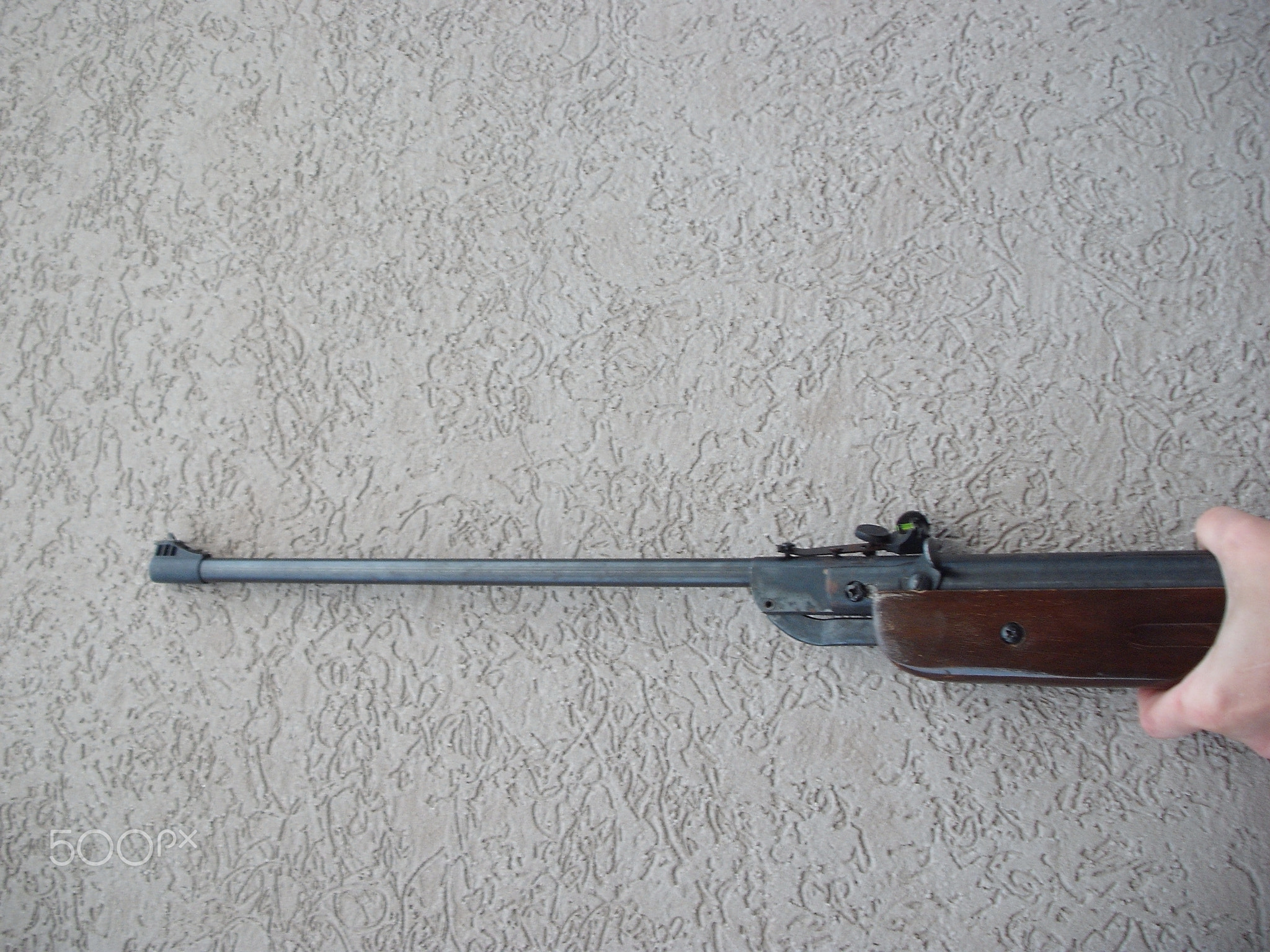 Folding air rifle for firing bullets