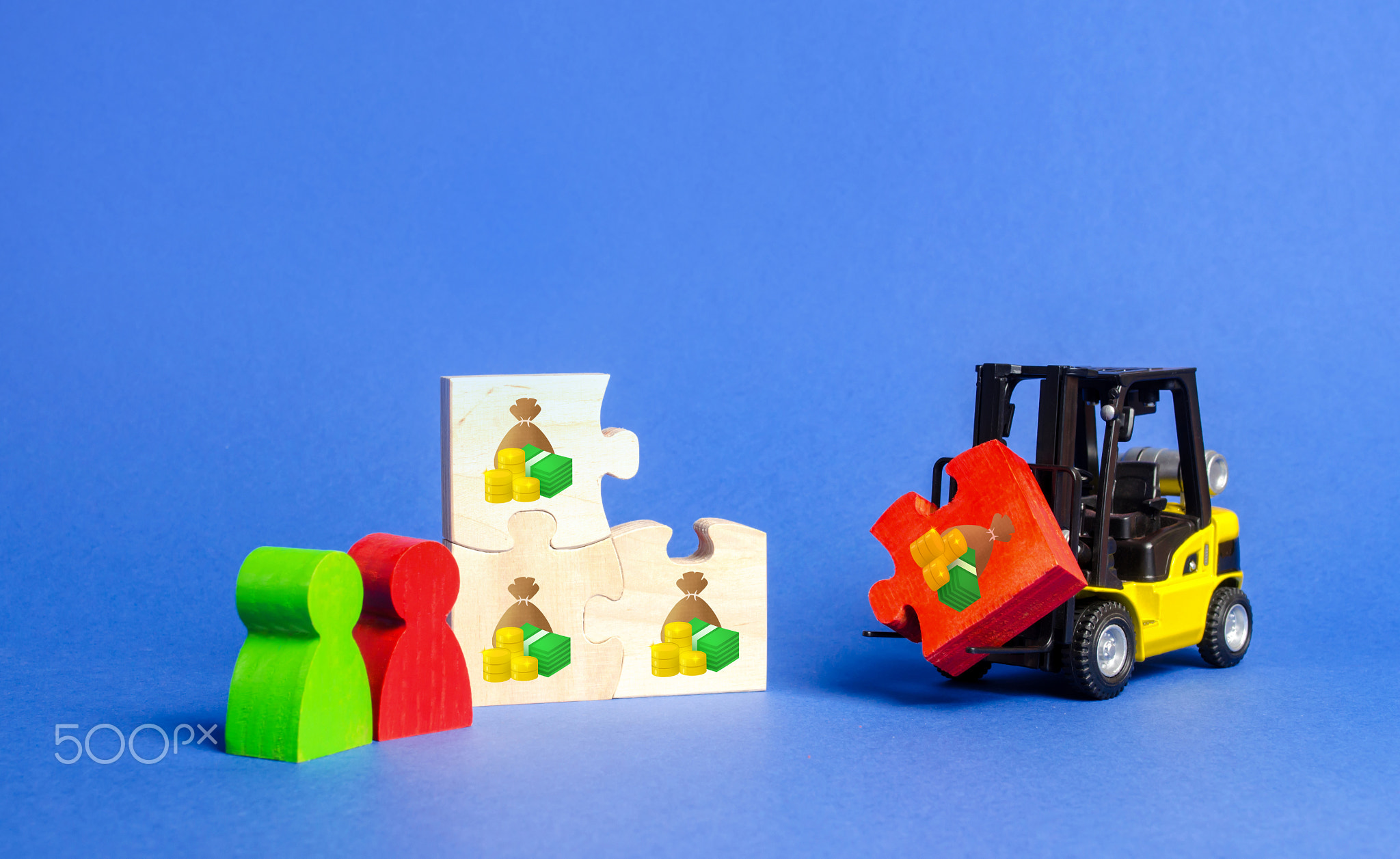 A forklift truck brings up a red missing puzzle to the general assembly