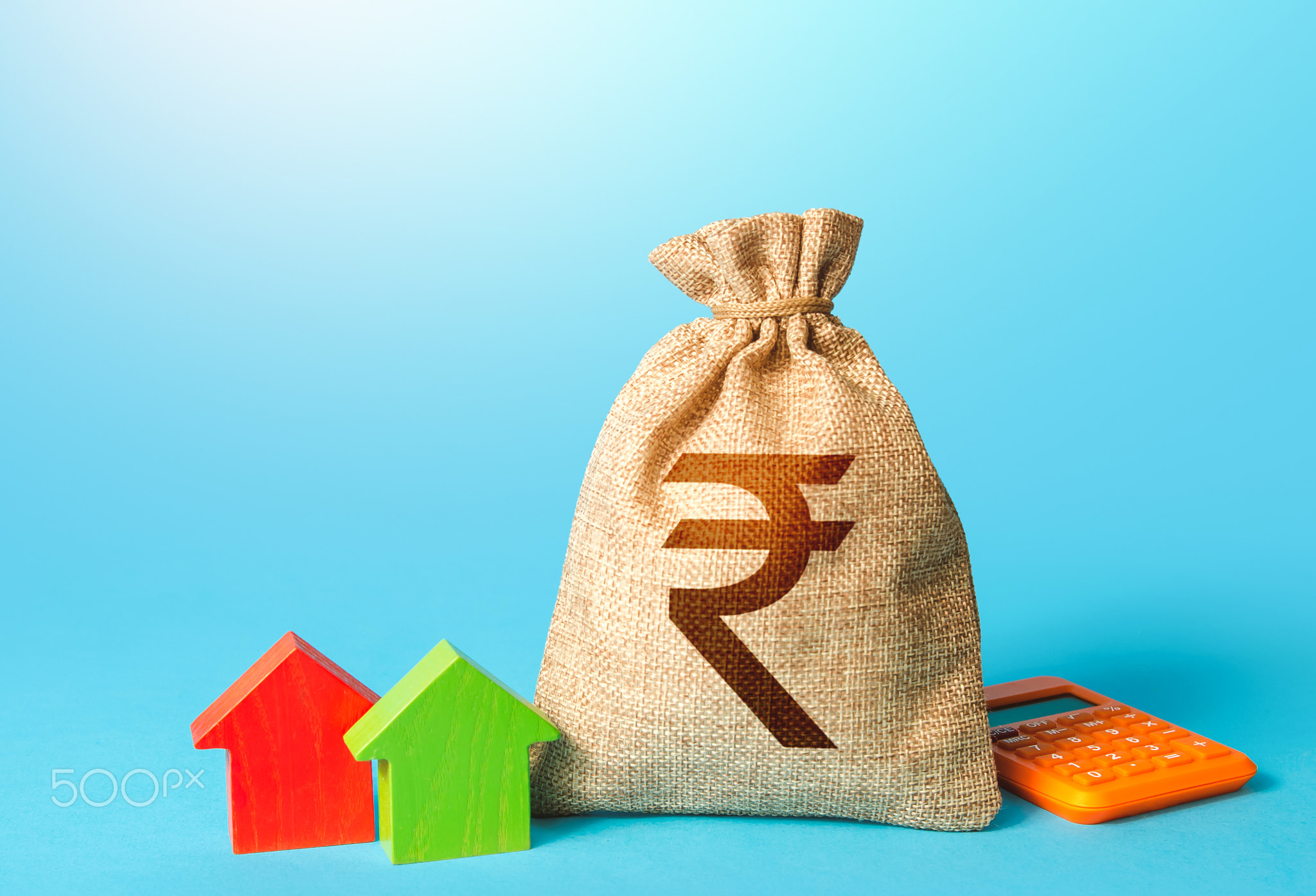 Indian rupee money bag and small houses