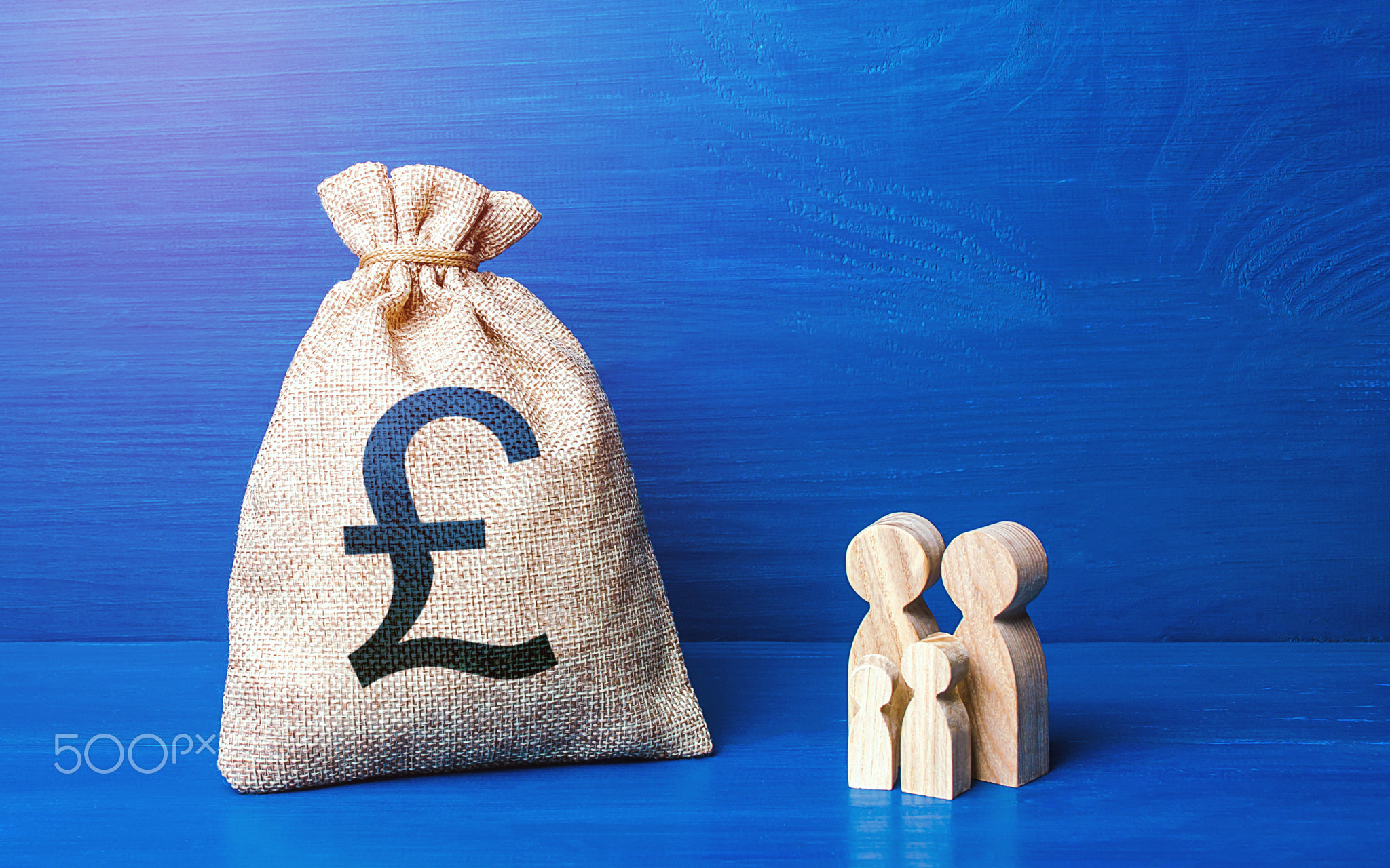 Family figurines and british pound sterling money bag