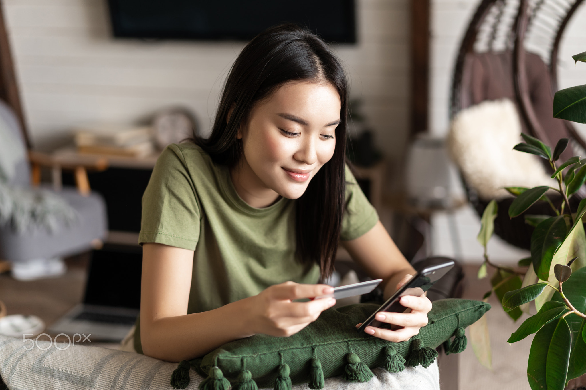 Online shopping. Korean girl making purchase online, shopping in