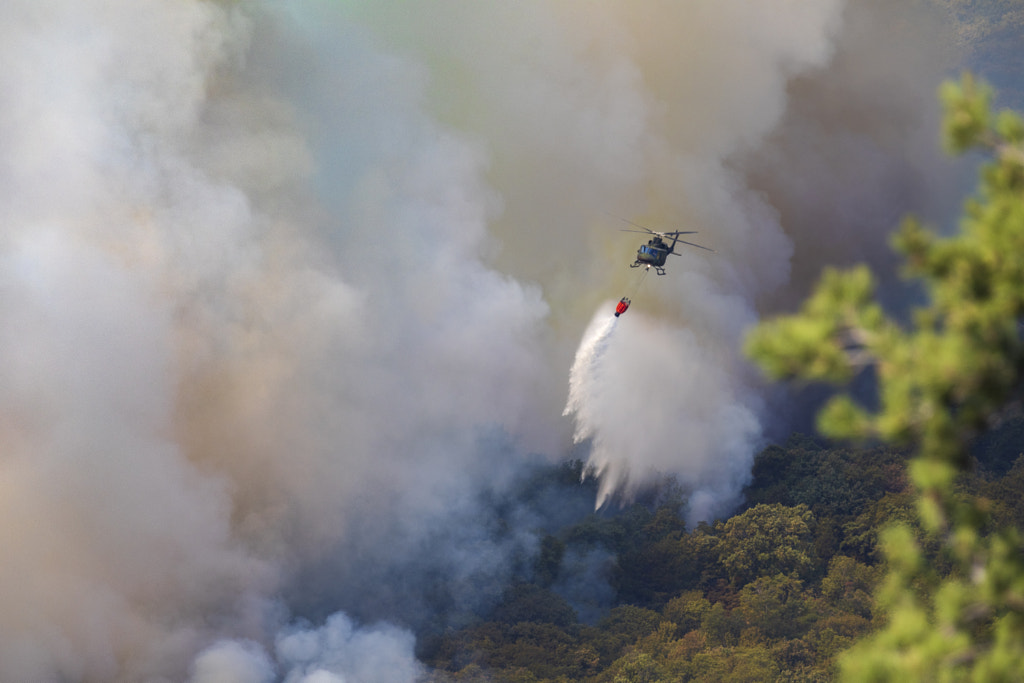 Helicopter Dropping Water on Wildfire by Jure Batagelj on 500px.com