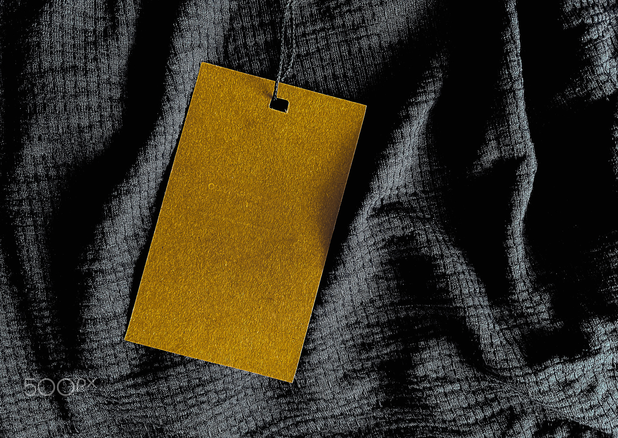 Blank fashion label tag, sale price card on luxury fabric background