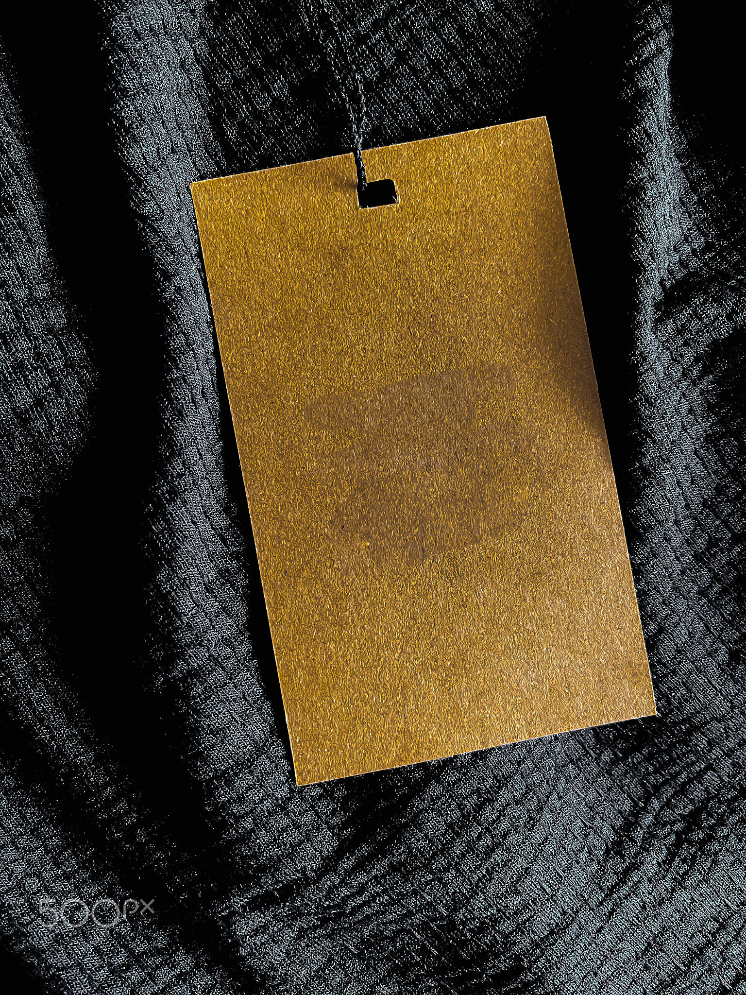 Blank fashion label tag, sale price card on luxury fabric background