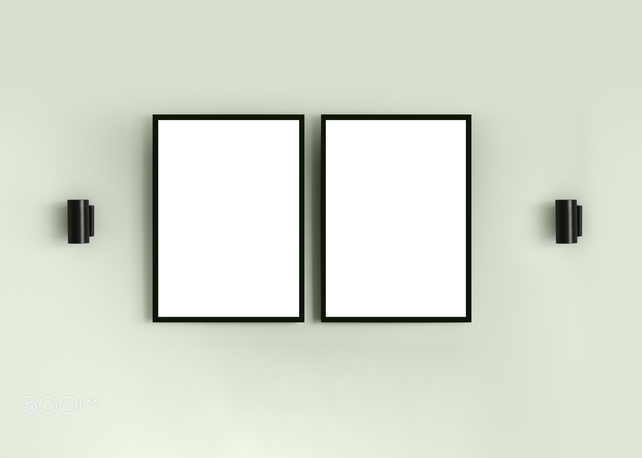 Two frames with blank white isolated posters on the mint green wall
