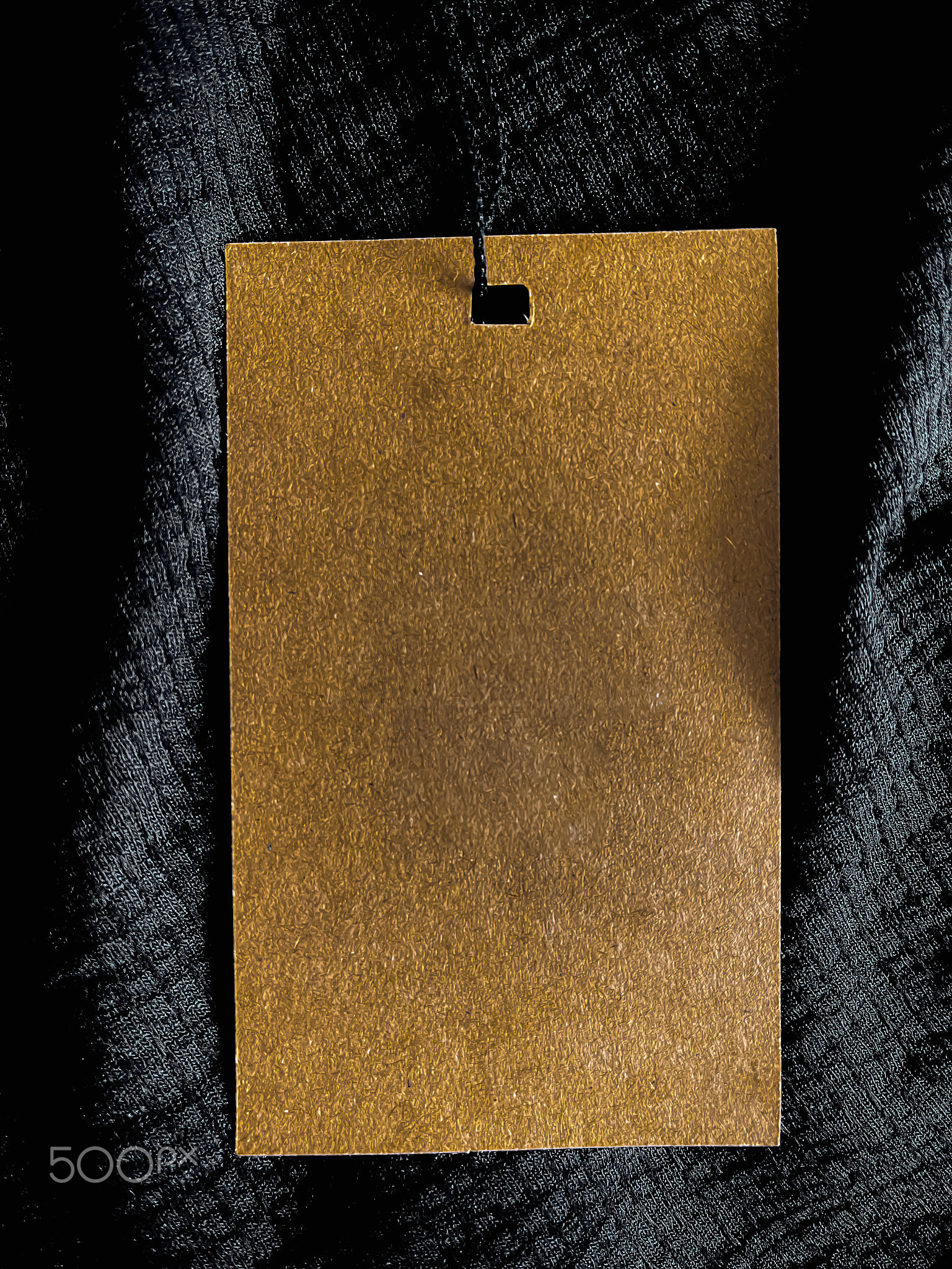 Blank fashion label tag, sale price card on luxury fabric background