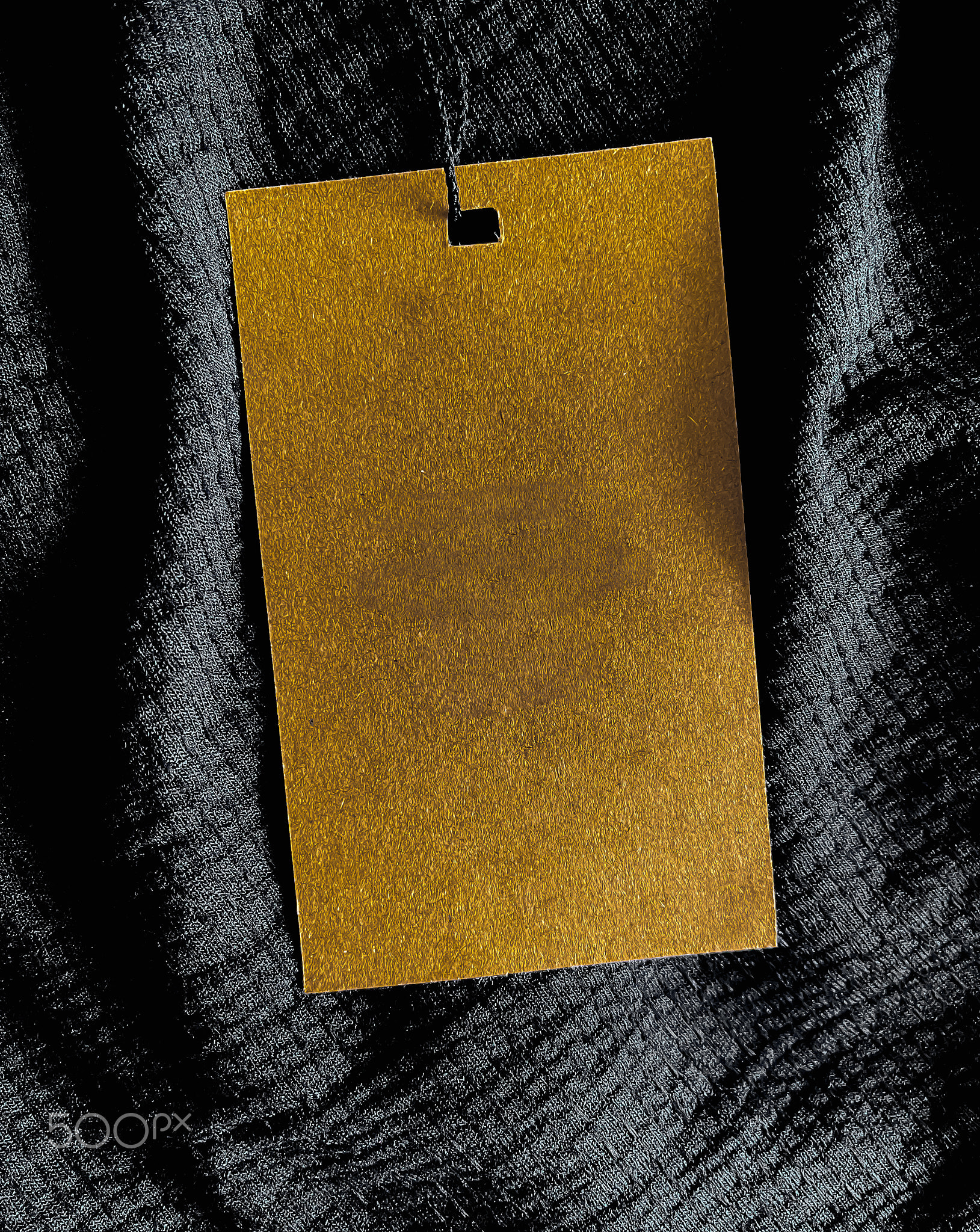 Blank fashion label tag, sale price card on luxury fabric background