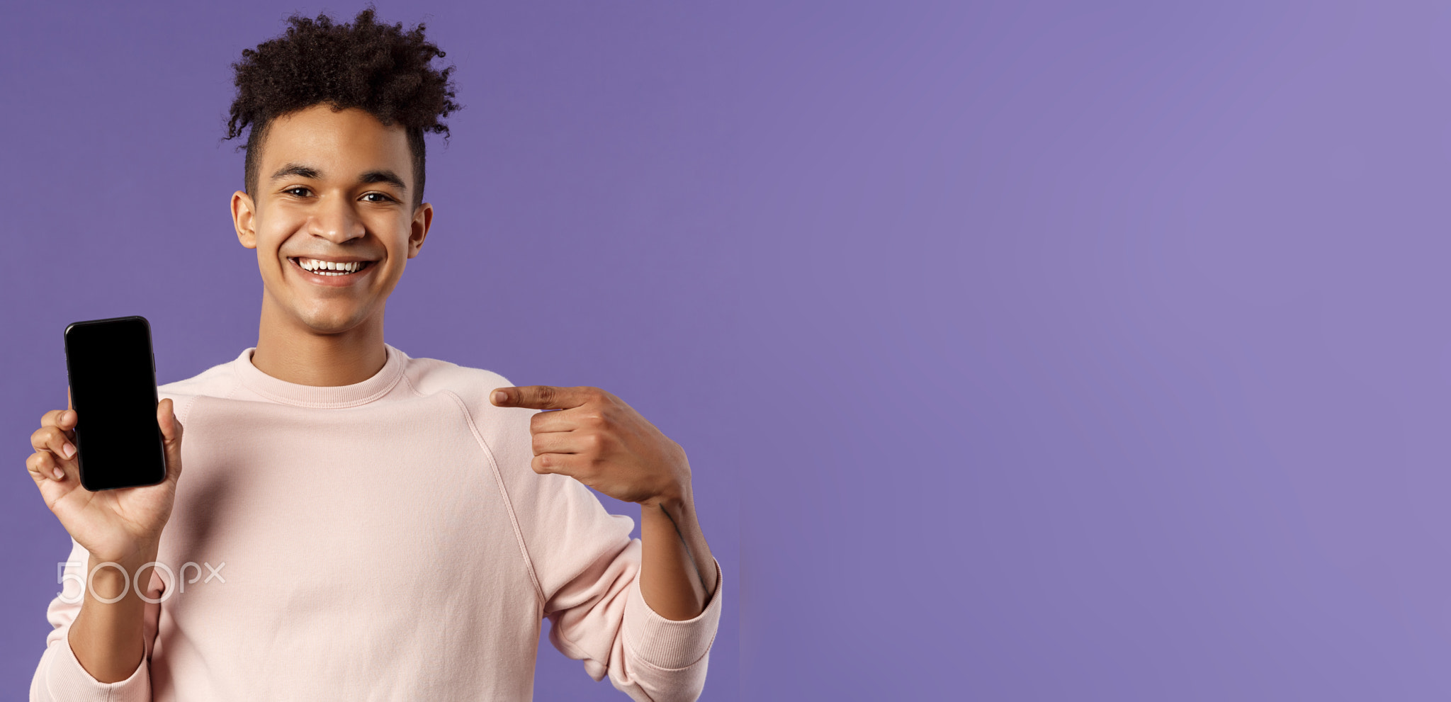 Close-up portrait of young handsome man promoting smartphone app or