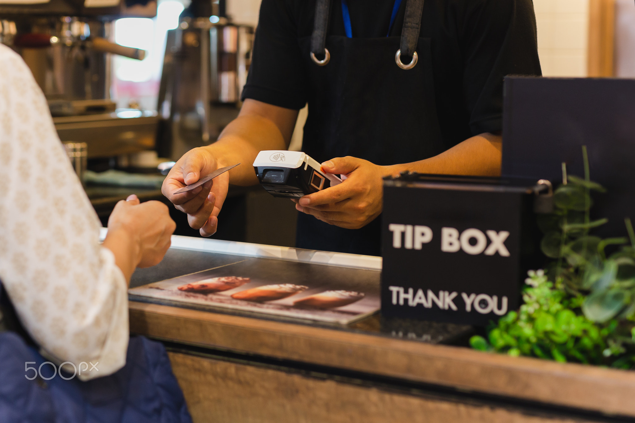 Asia woman use cashless wifi paywave scan on card reader in coffee