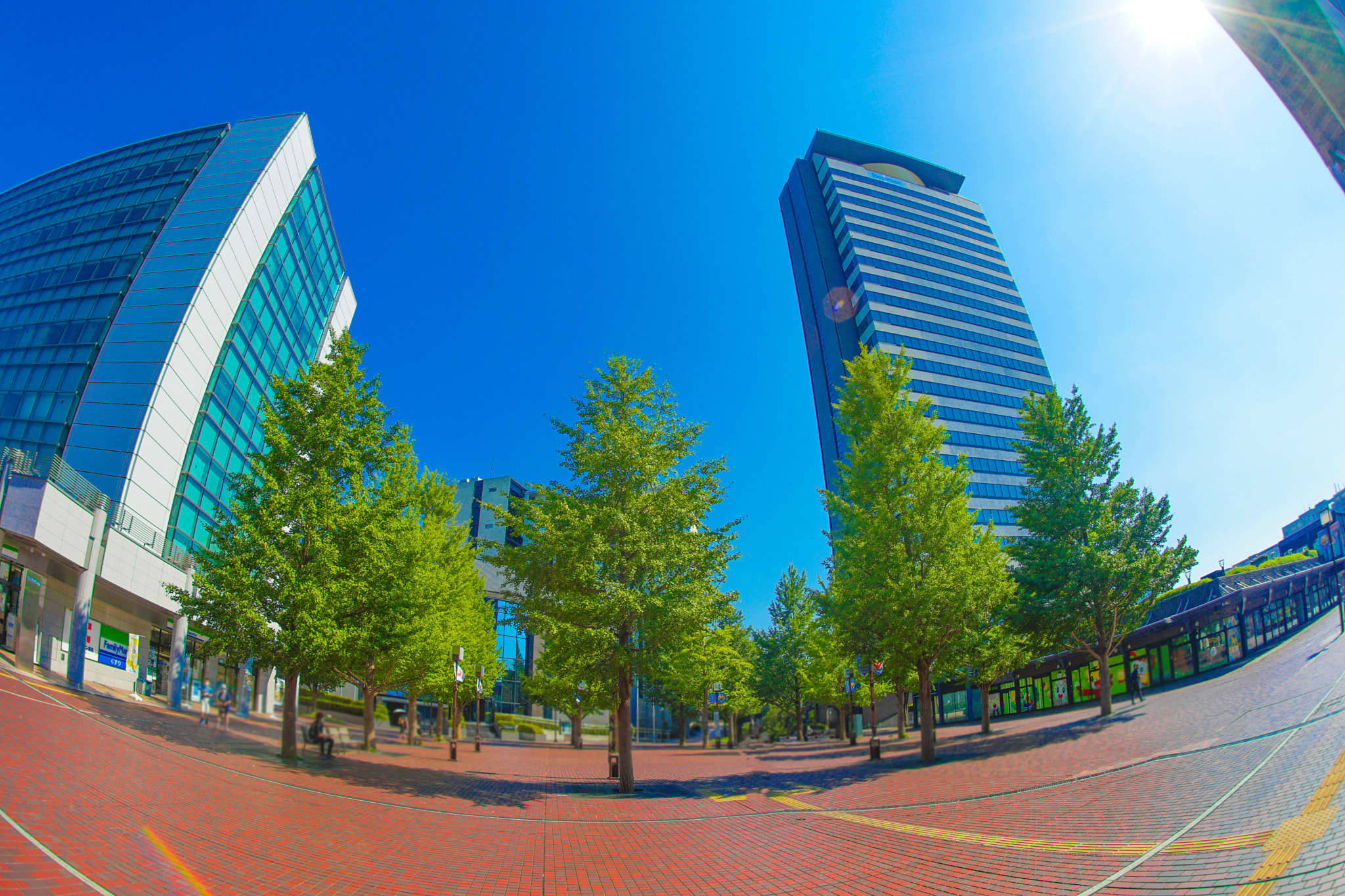 Low angle view of modern buildings against blue sky