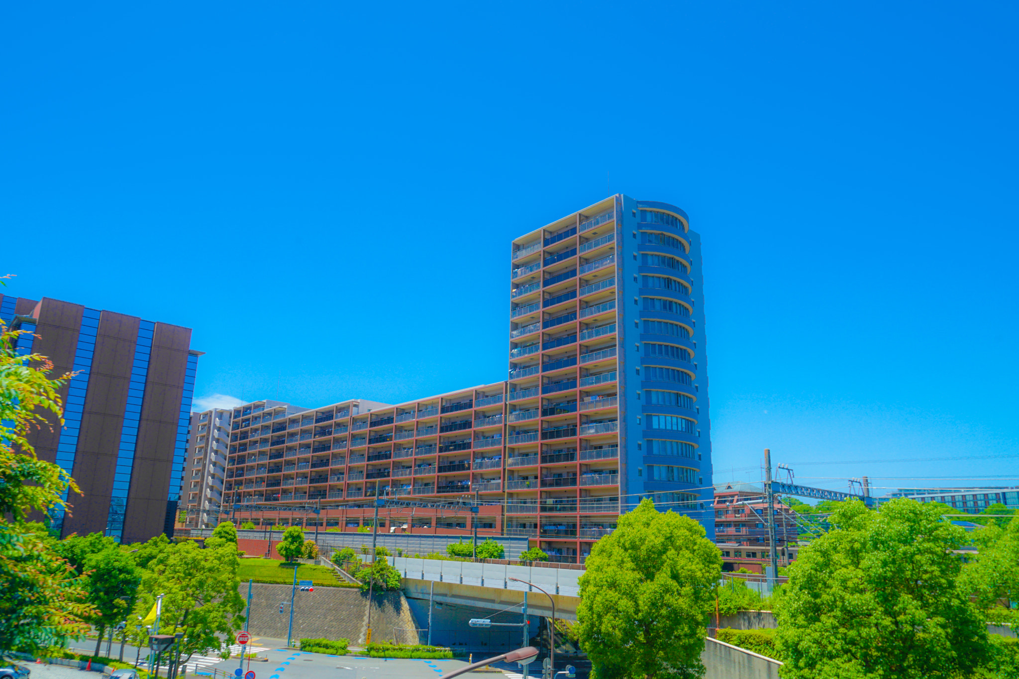 Low angle view of modern buildings against clear blue sky