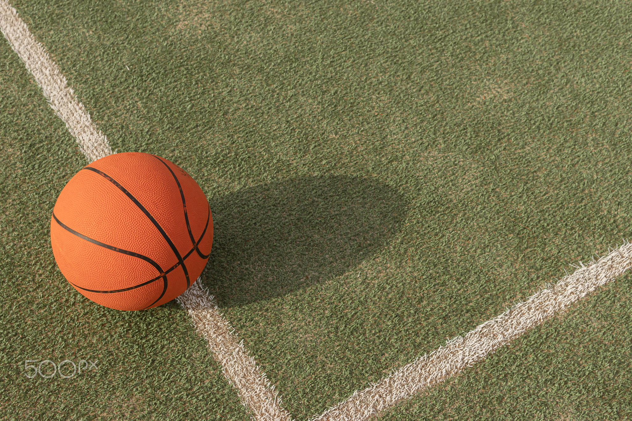 basketball ball isolated on the playing field on the right side there