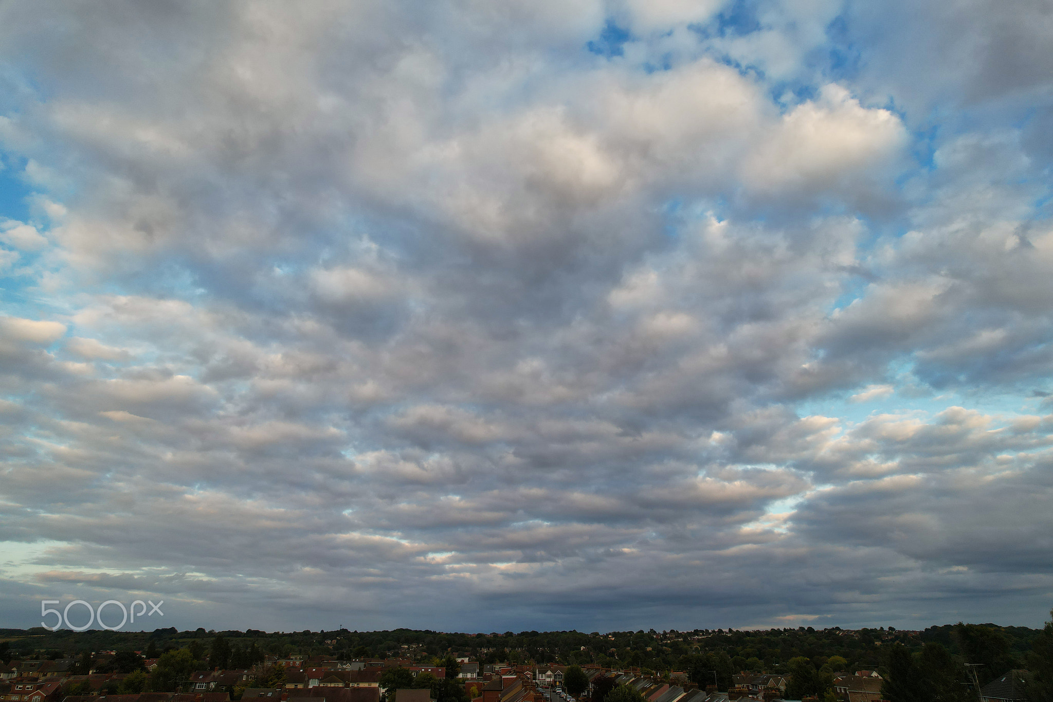 Aerial view of townscape against sky