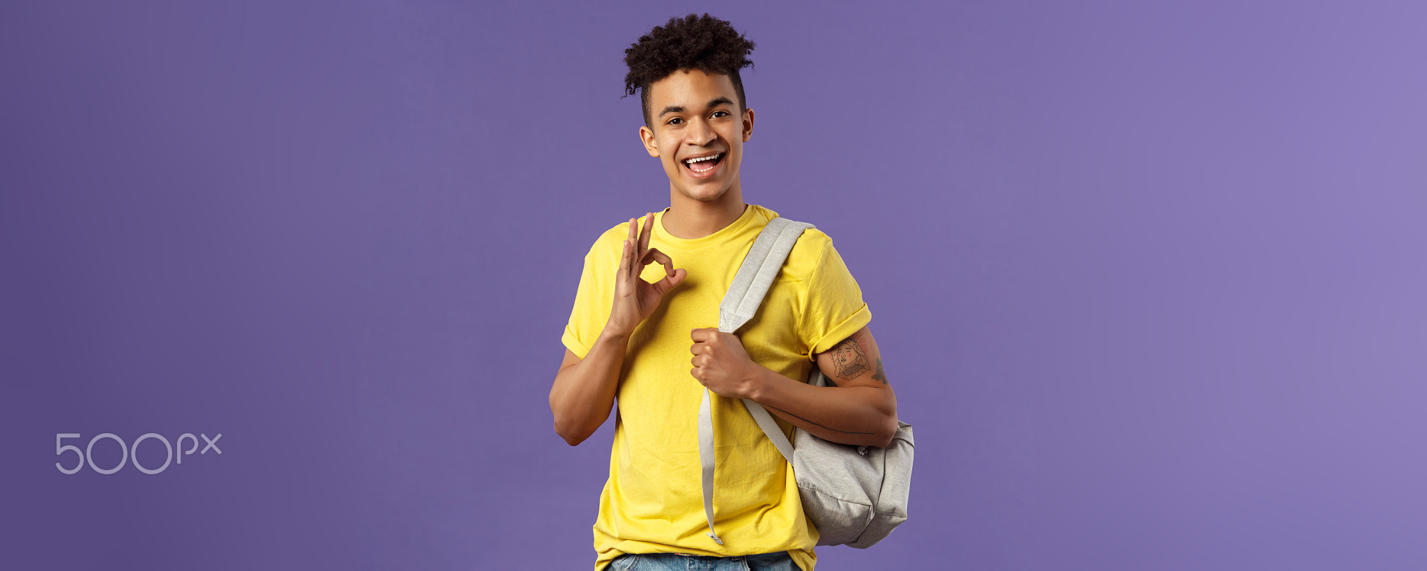 Back to school, university concept. Portrait of young handsome hipster