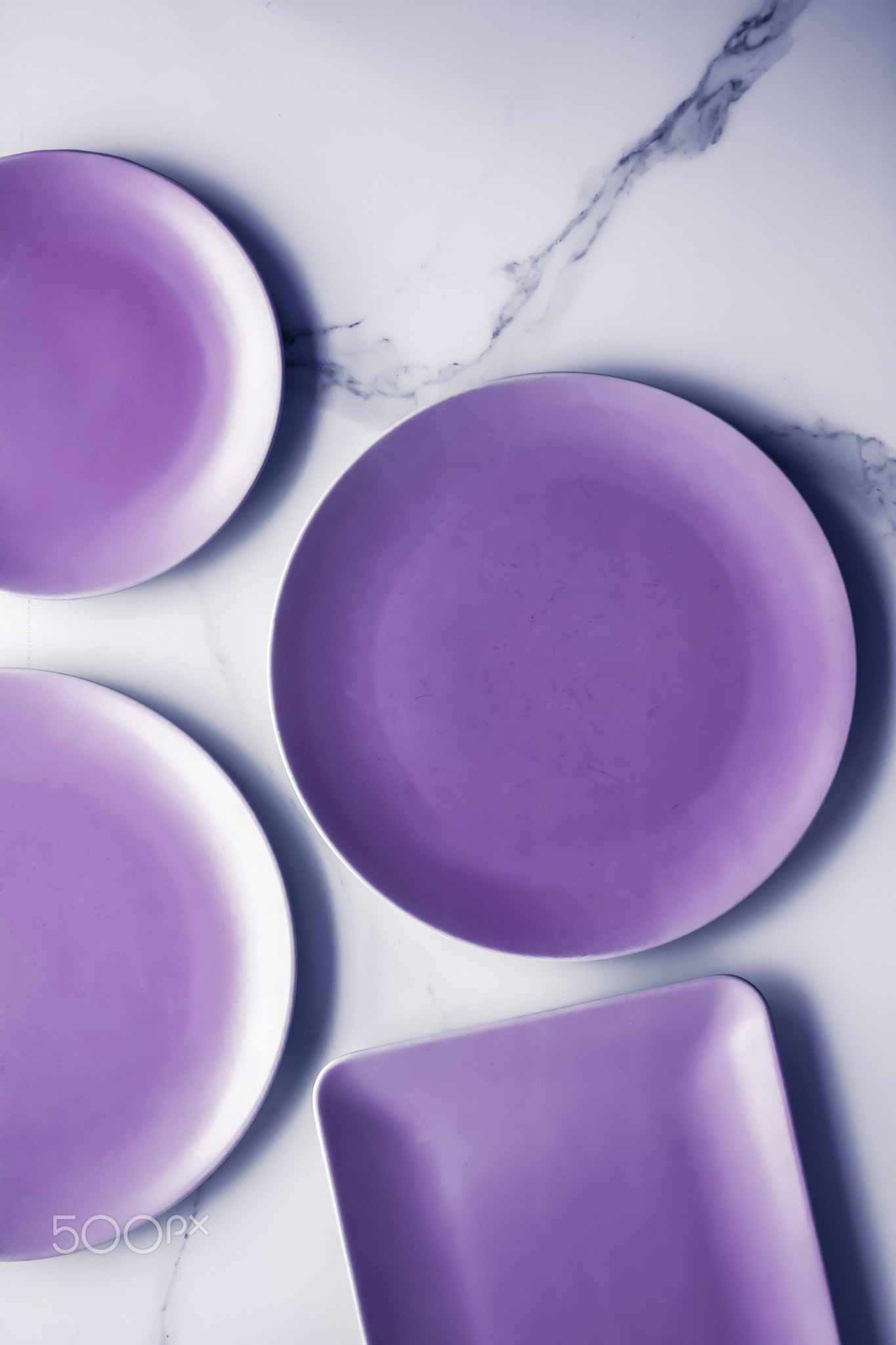 Purple empty plate on marble table background, tableware decor for