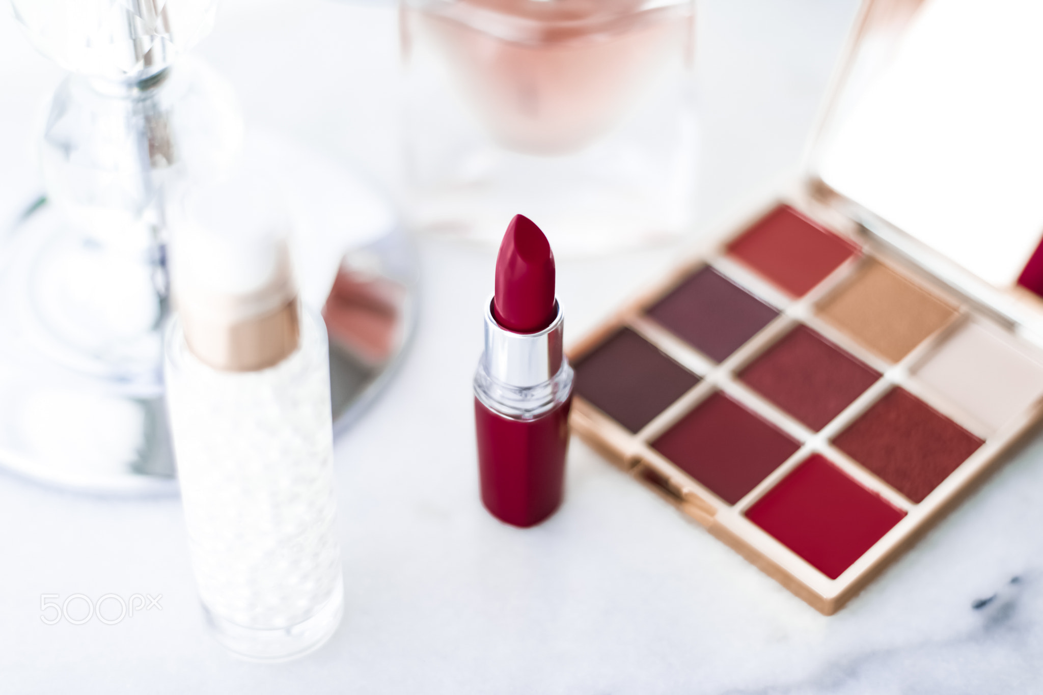 Cosmetics, makeup products on dressing vanity table, lipstick