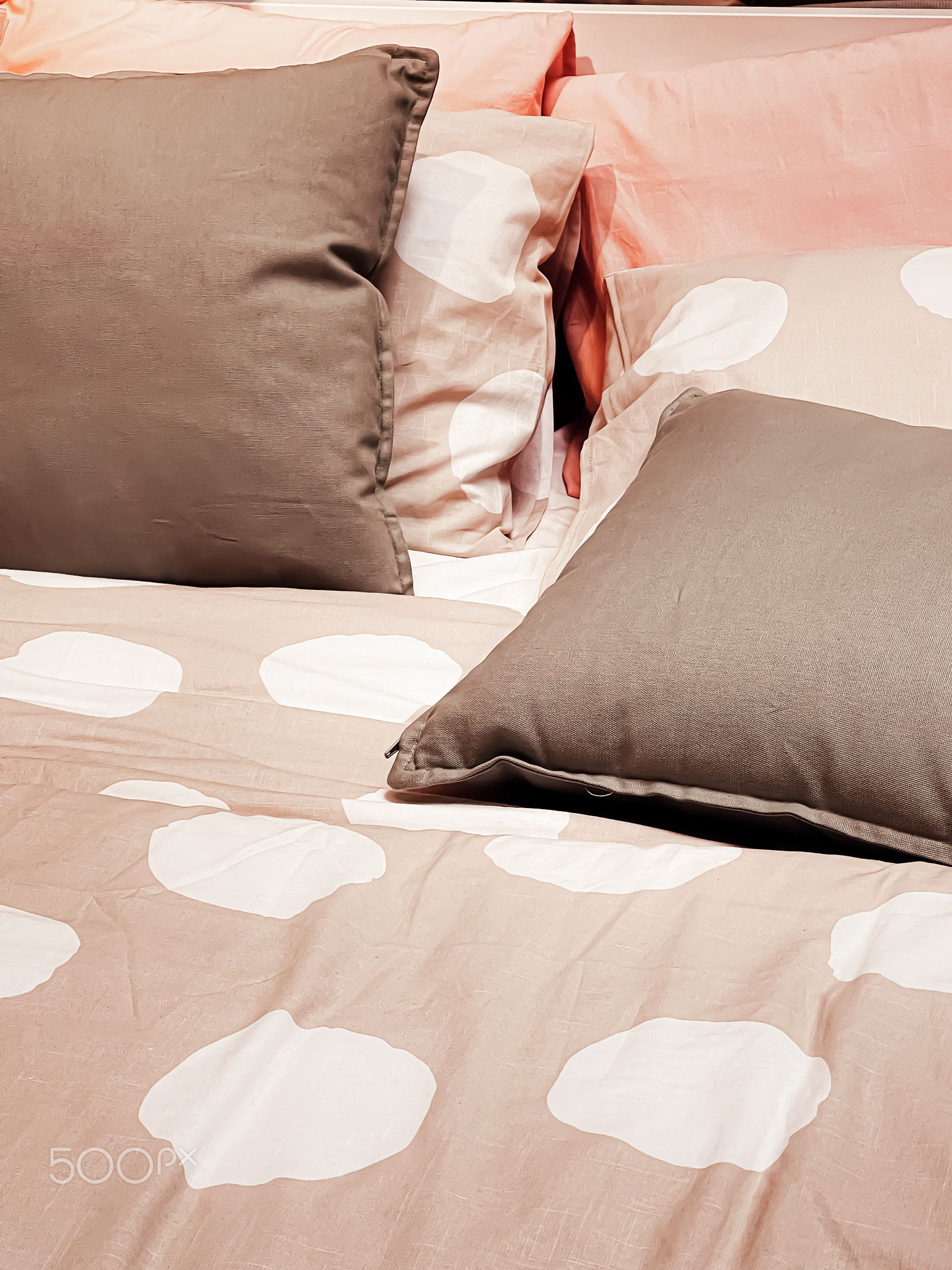 Modern style bedding on bed in bedroom, interior design