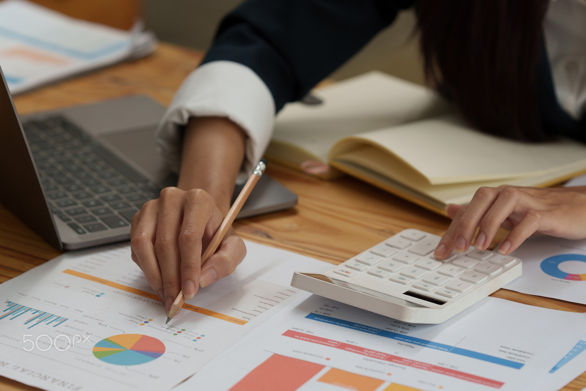 Business woman calculating the company's financial results and budget