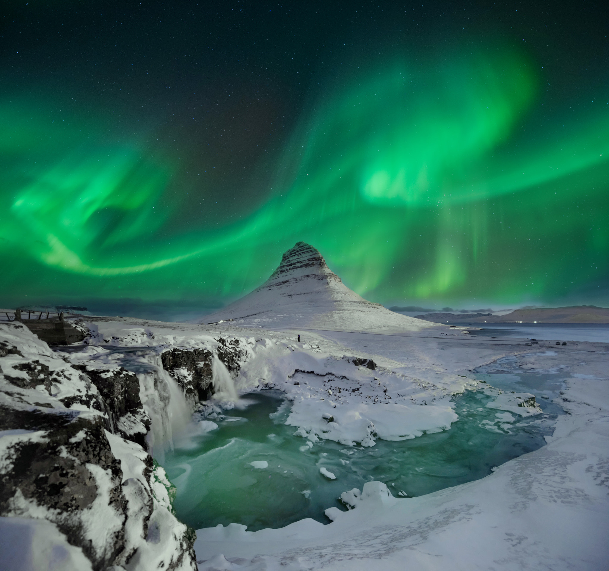 Scenic view of aurora borealis over lake against sky at night by ...