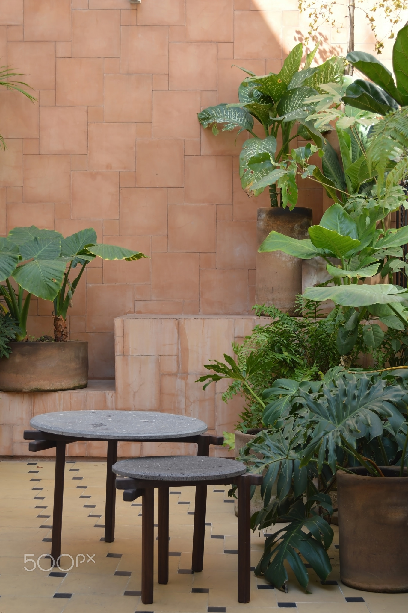 designer side or center coffee table, top in natural stone, volcanic stone, quarry or terrazz