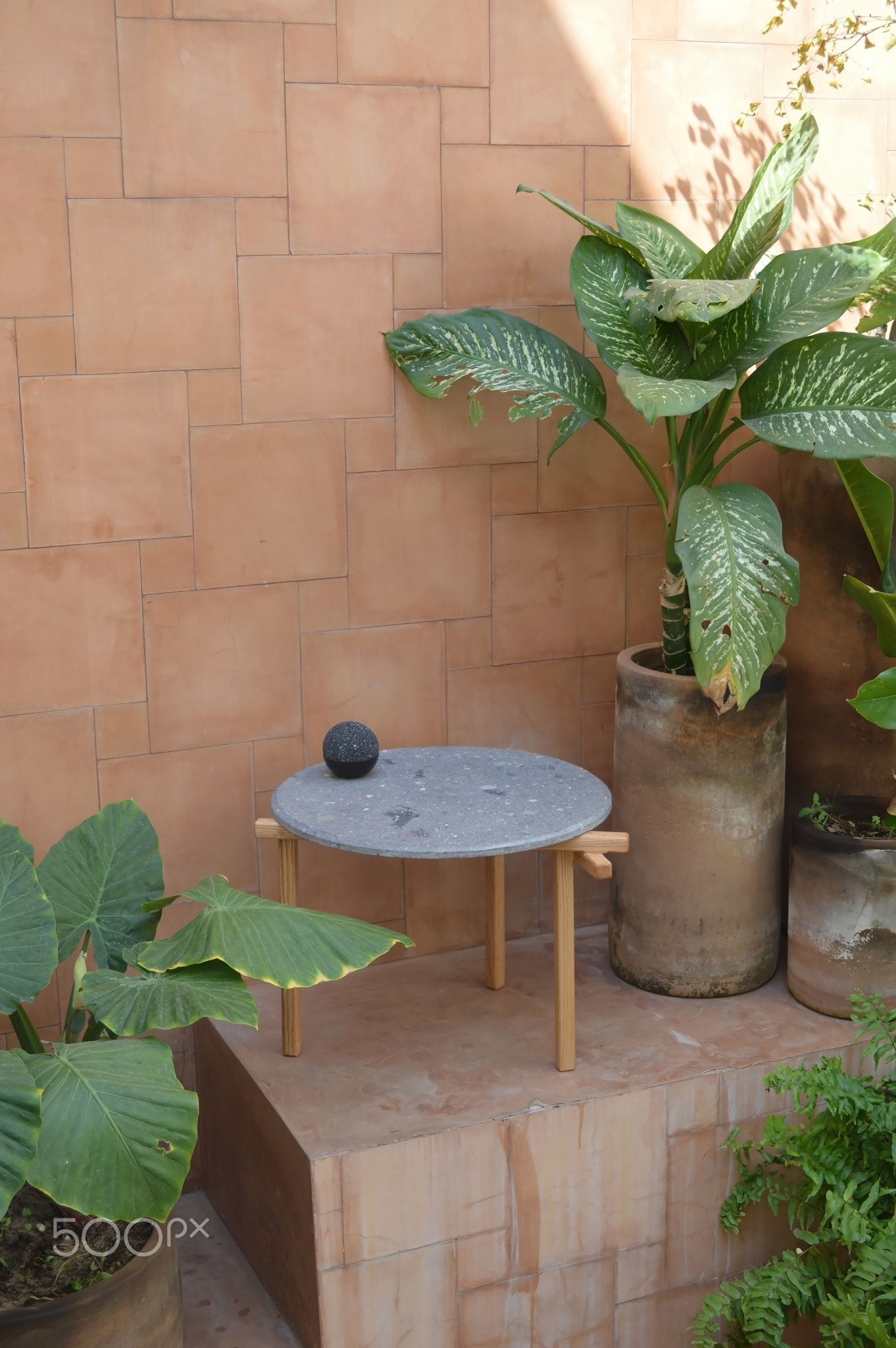 designer side or center coffee table, top in natural stone, volcanic stone, quarry or terrazz