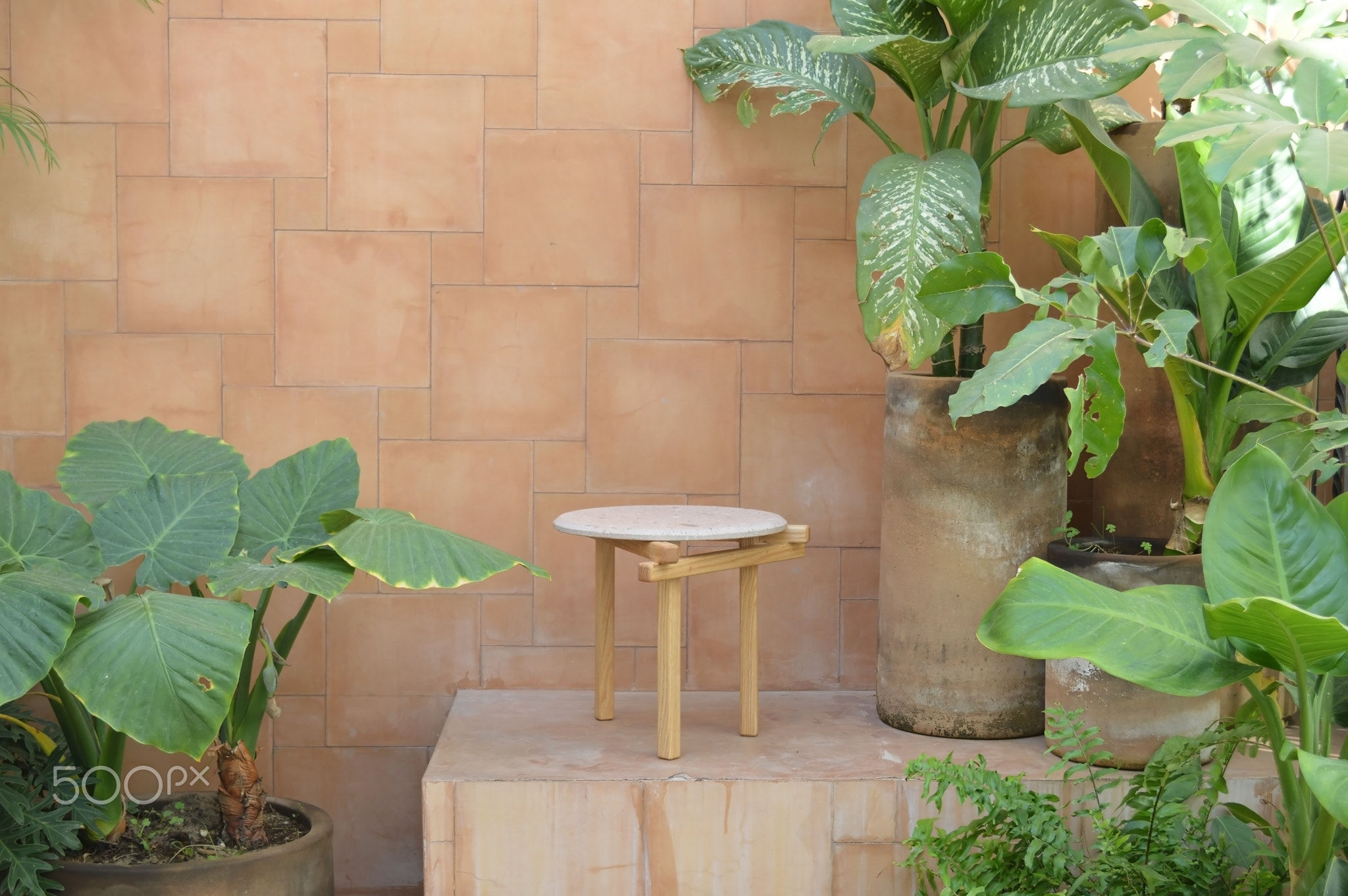 designer side or center coffee table, top in natural stone, volcanic stone, quarry or terrazz