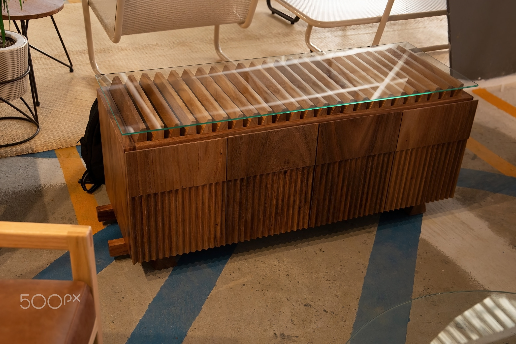 wooden credenza, buffet with natural stone on the deck