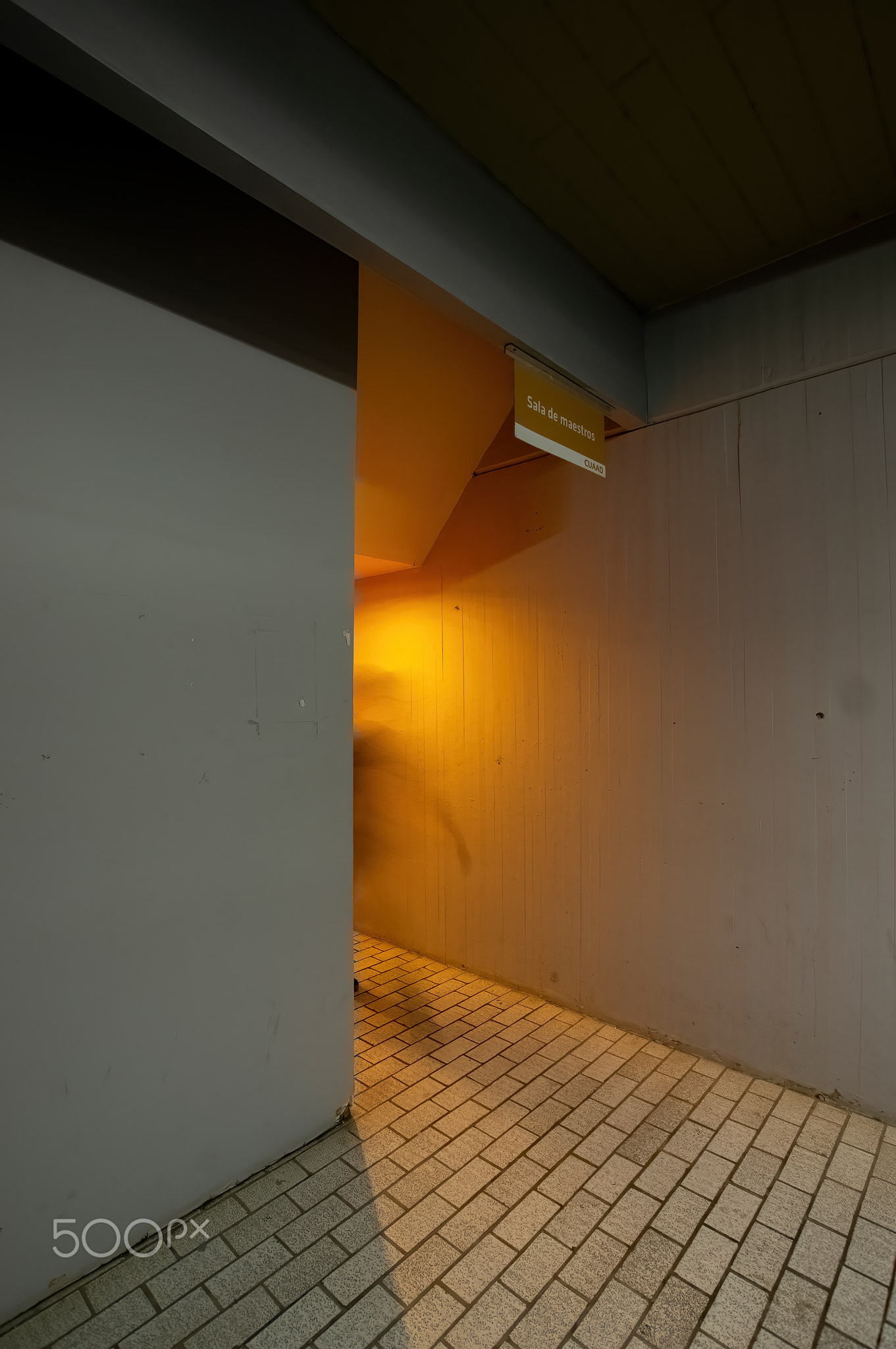 orange light that contrasts with the concrete modern concrete