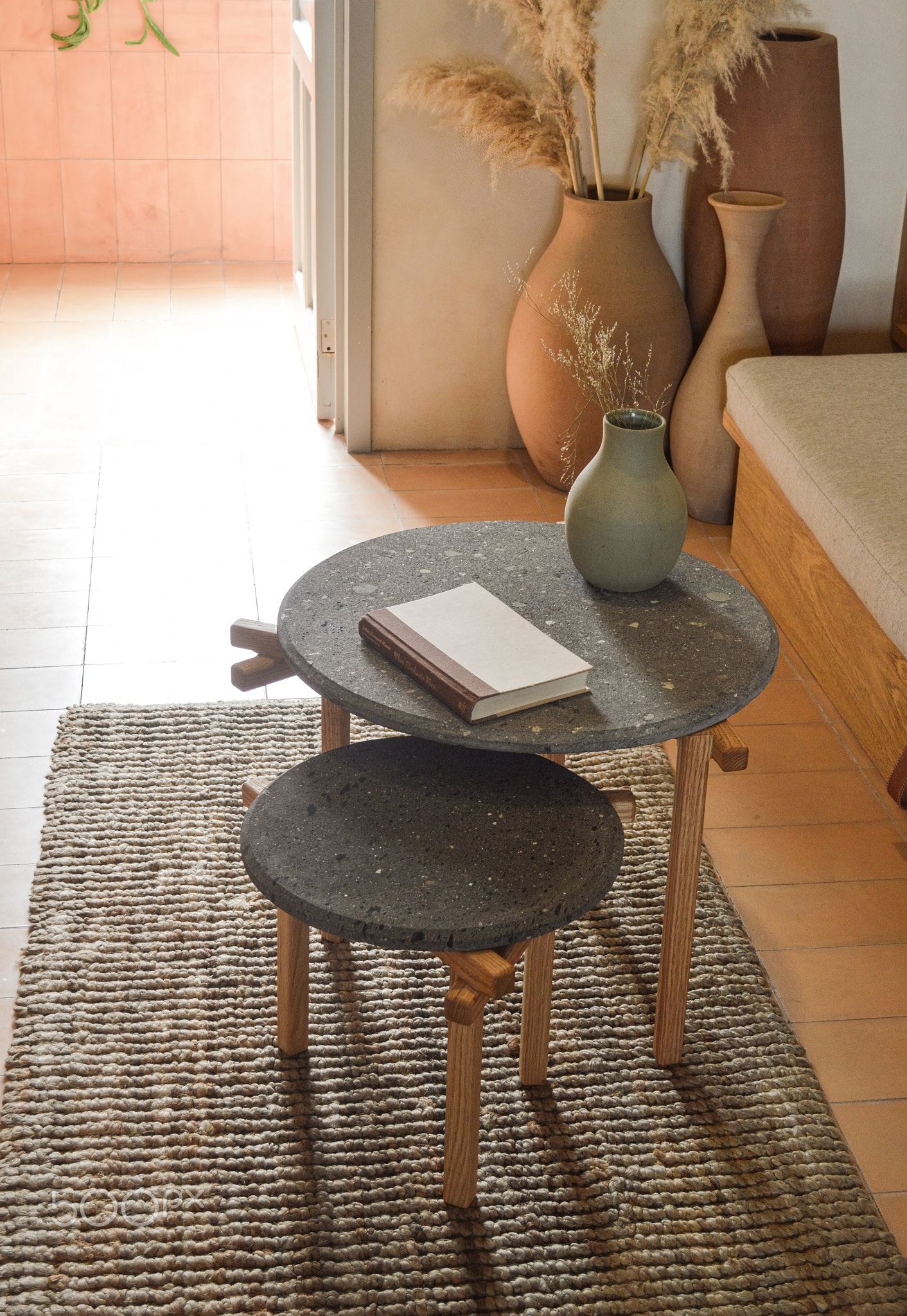 designer side or center coffee table, top in natural stone, volcanic
